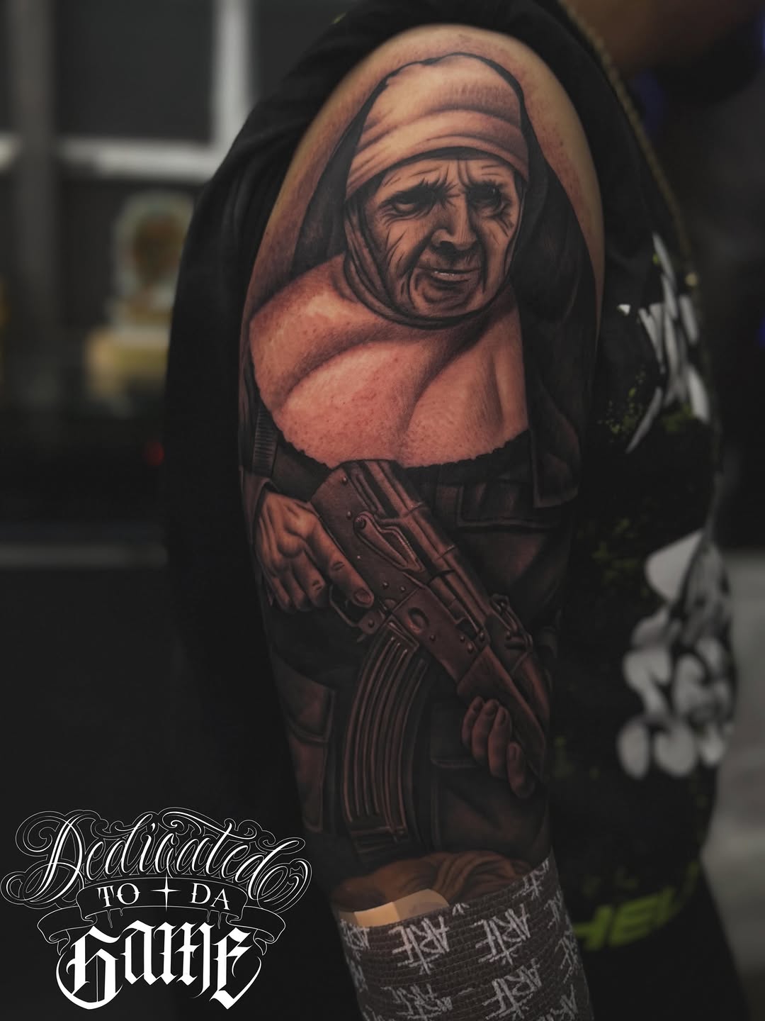 Woman with gun Chicano tattoo on the forearm by LOS