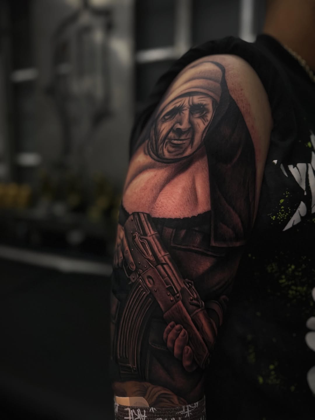 Old woman holding a rifle realism tattoo on the upper arm by LOS