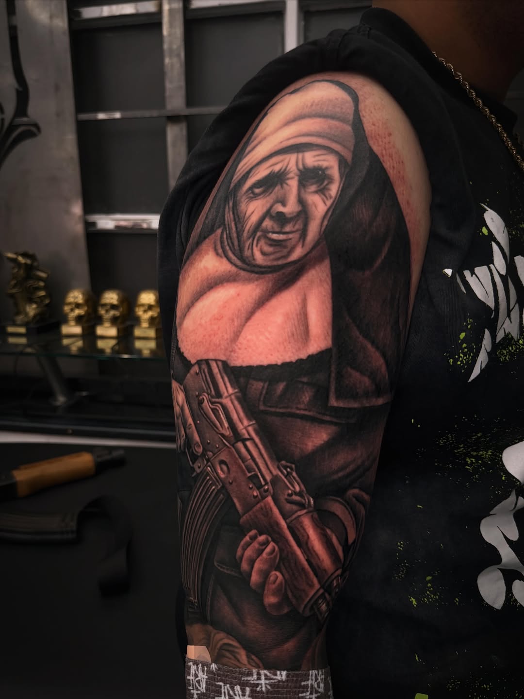 Nun holding a rifle realism tattoo on the upper arm by LOS