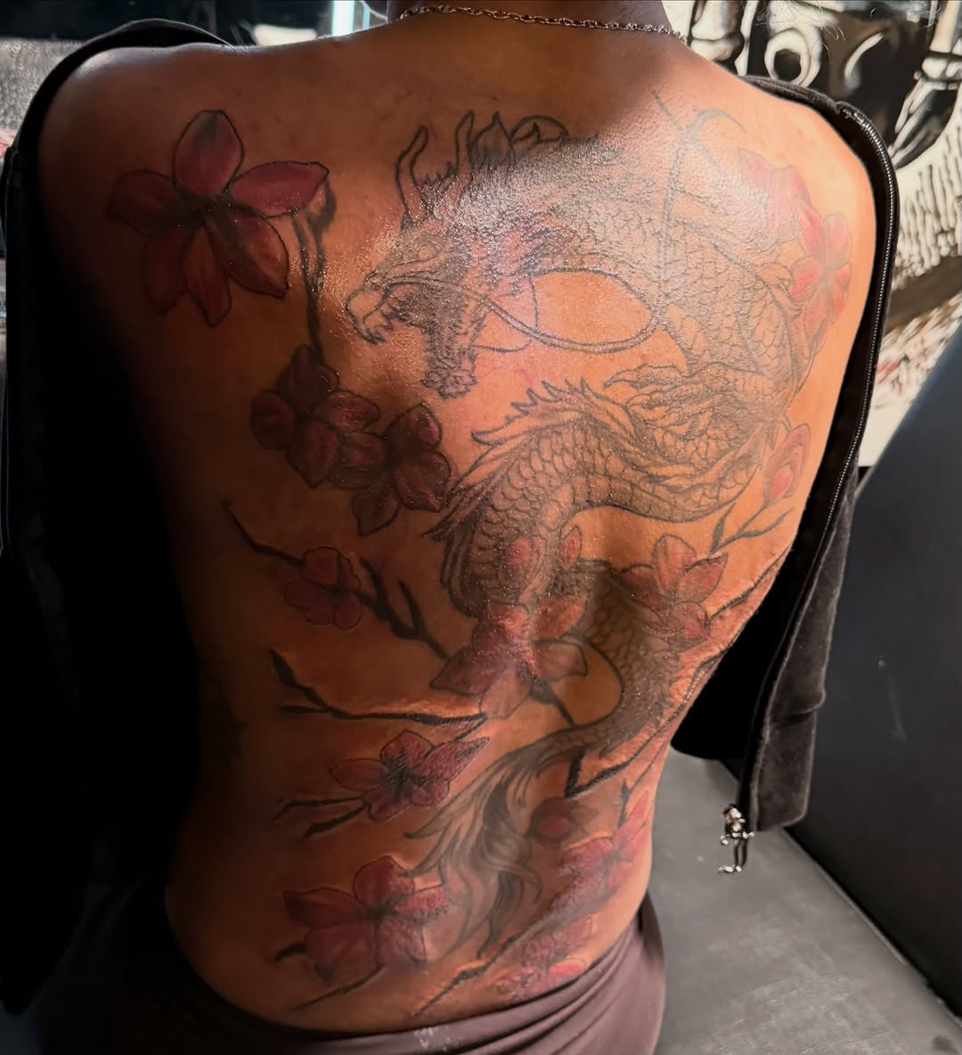 Dragon and cherry blossoms Japanese tattoo on the back by Shine Jefferson, Memphis, Tennessee