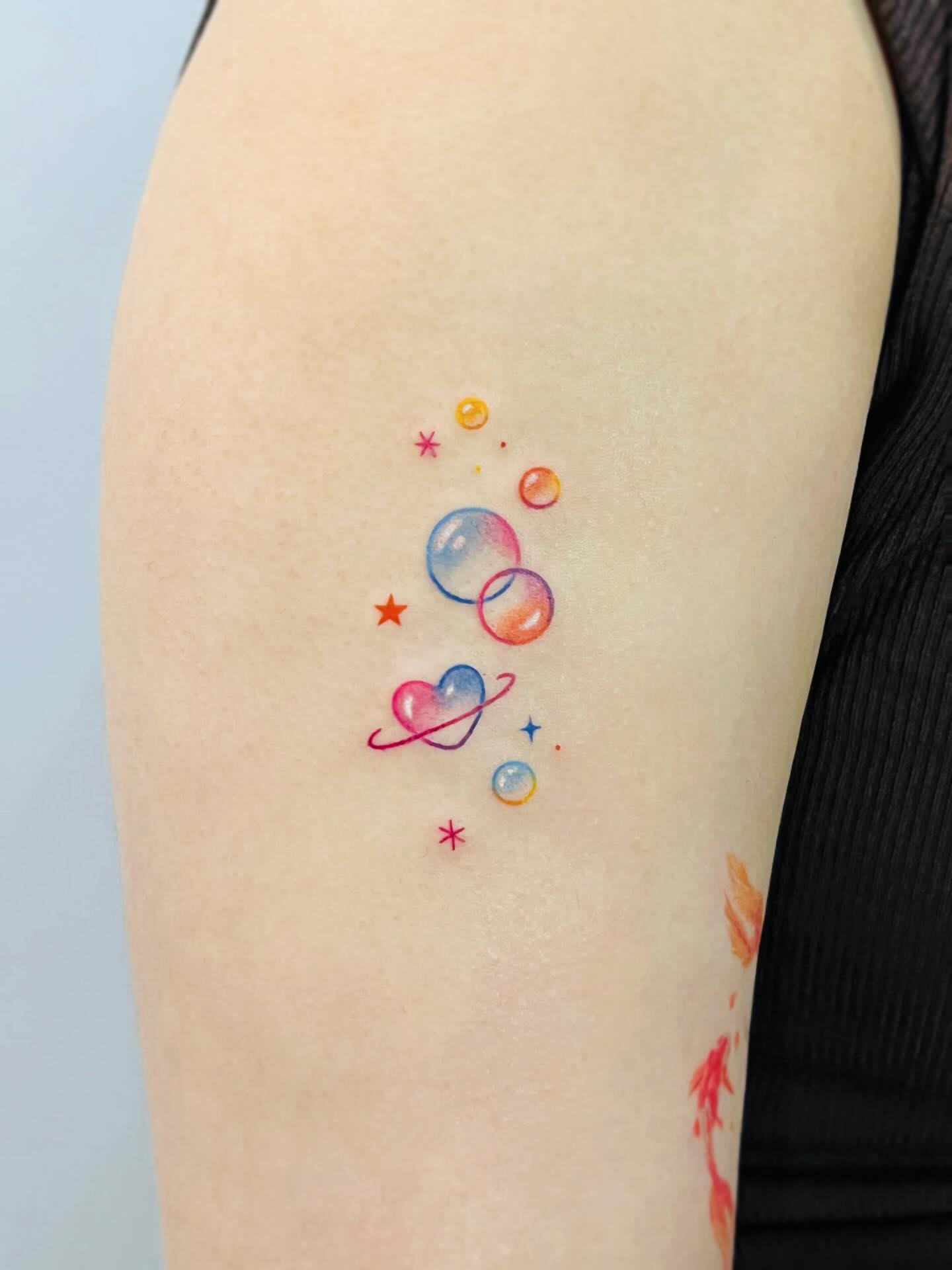 Galaxy watercolor tattoo on the forearm by Purinn