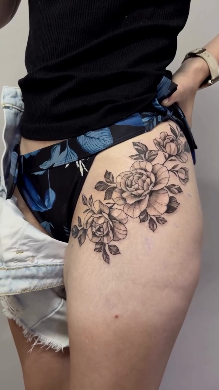 Floral arrangement on thigh neo-traditional tattoo on the thigh by Art by Aimee