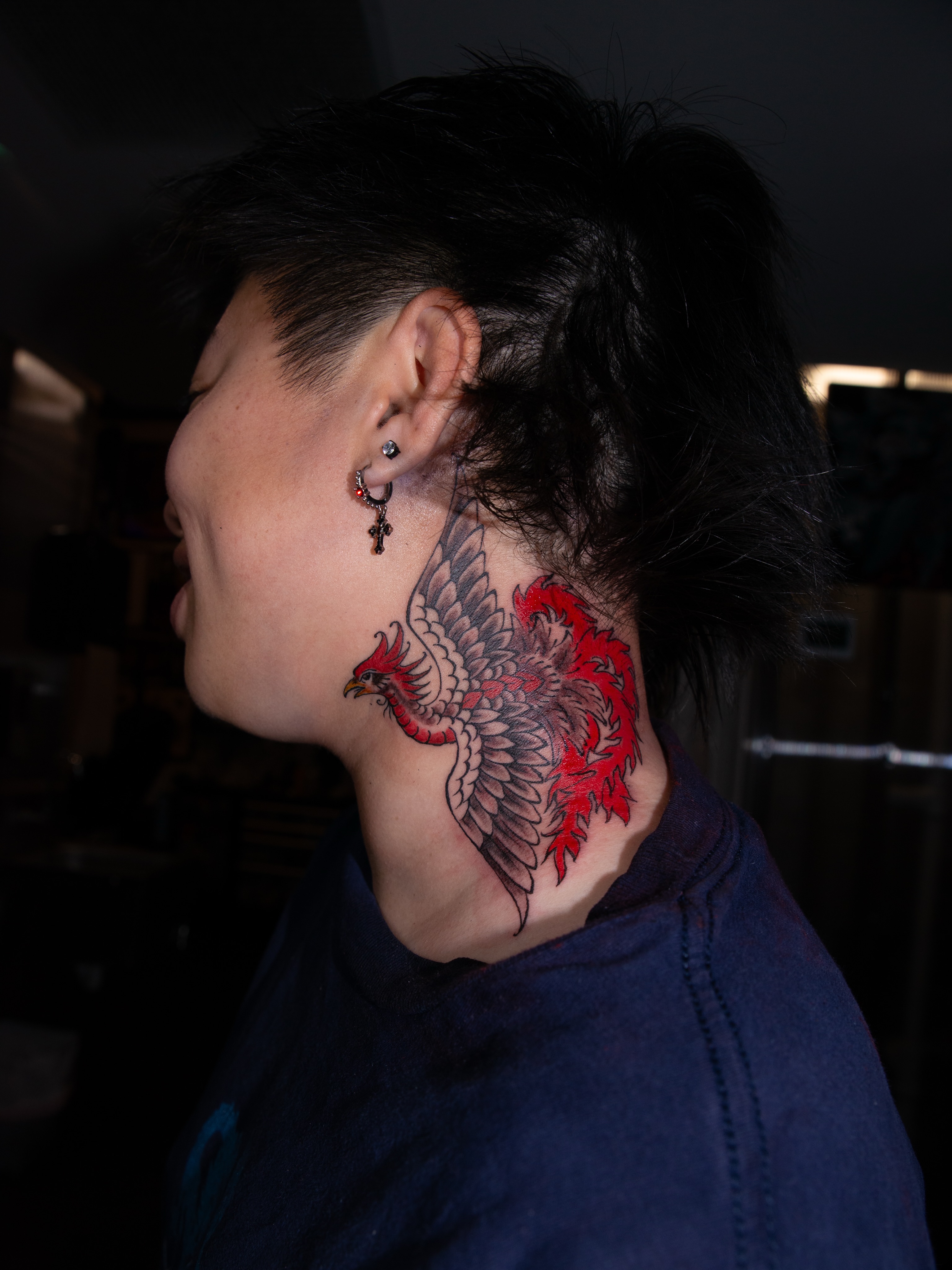 Phoenix American traditional tattoo on the neck by Trevor Aarsvold, Minneapolis, Minnesota