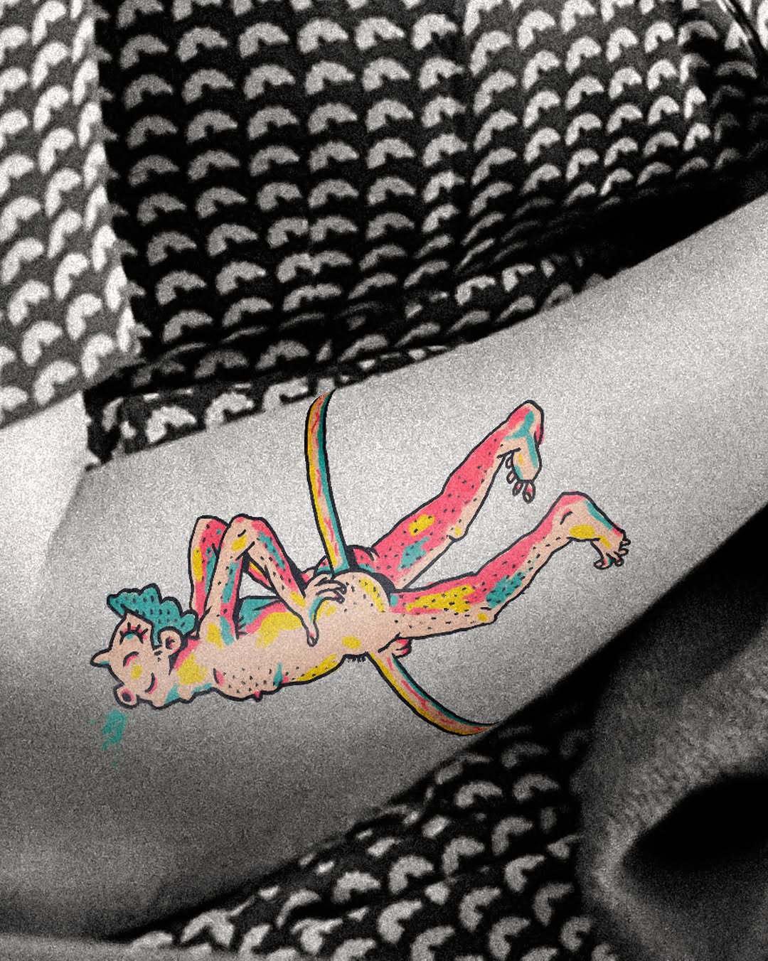 Figure on a hoop tattoo on the forearm by Flash Boom Bang Tattoo