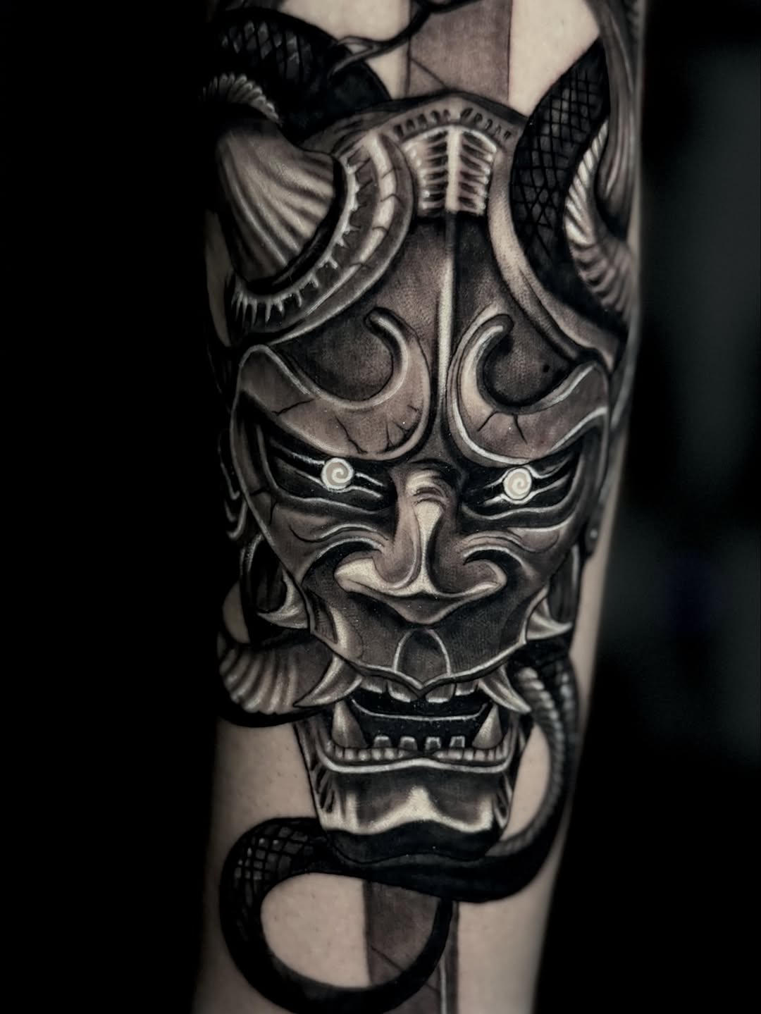 Oni mask and snake Japanese tattoo on the forearm by Chris galvis, Charlotte, North Carolina