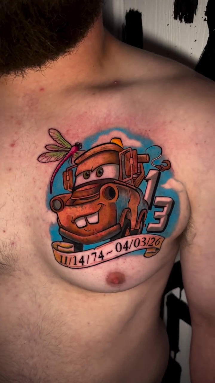 Mater from Cars with dates new school tattoo on the chest by Nick Andrade Las Vegas Tattoo Artist