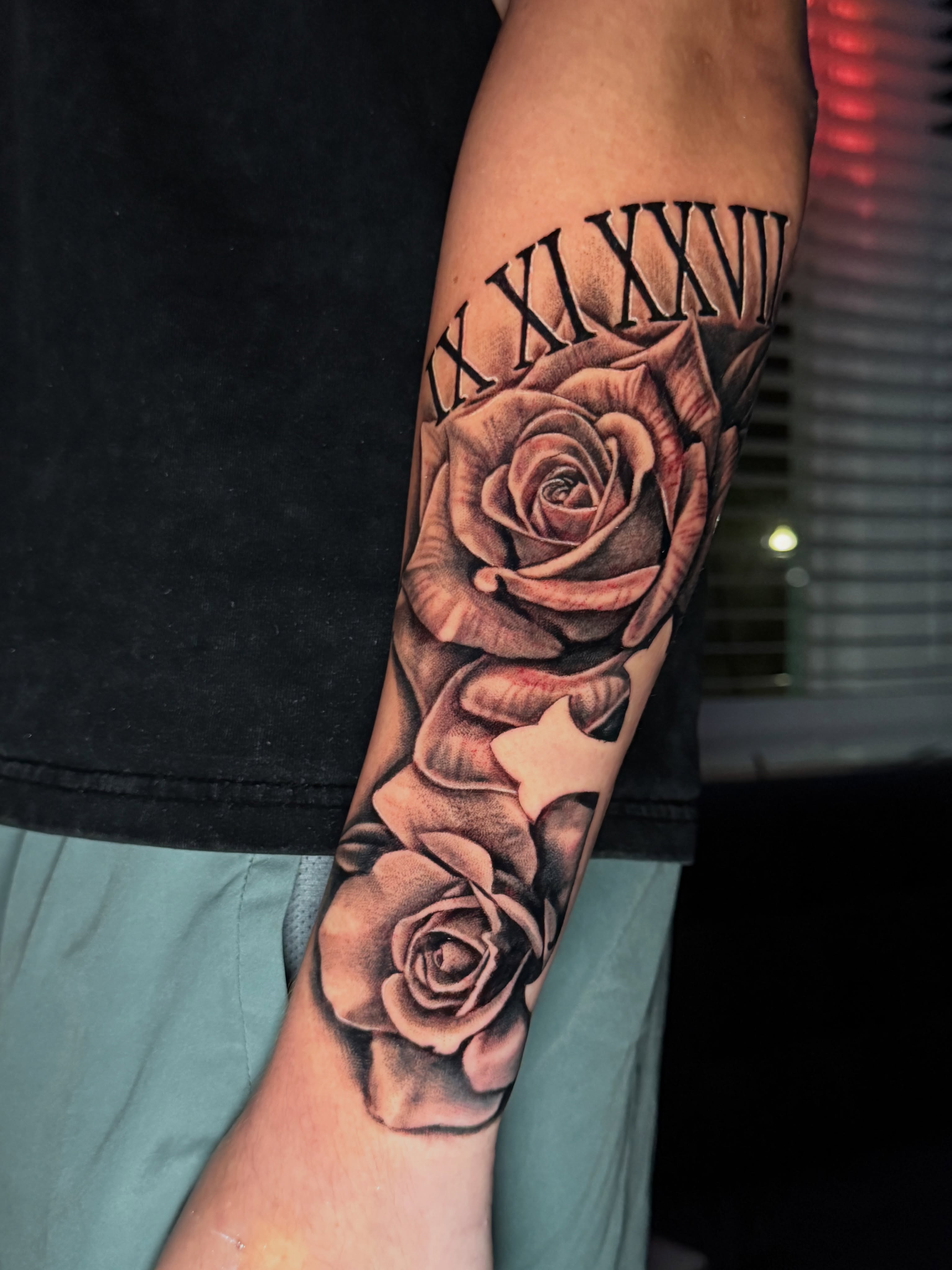 Roses realism tattoo on the forearm by Quentin Stevenson, Slidell, Louisiana