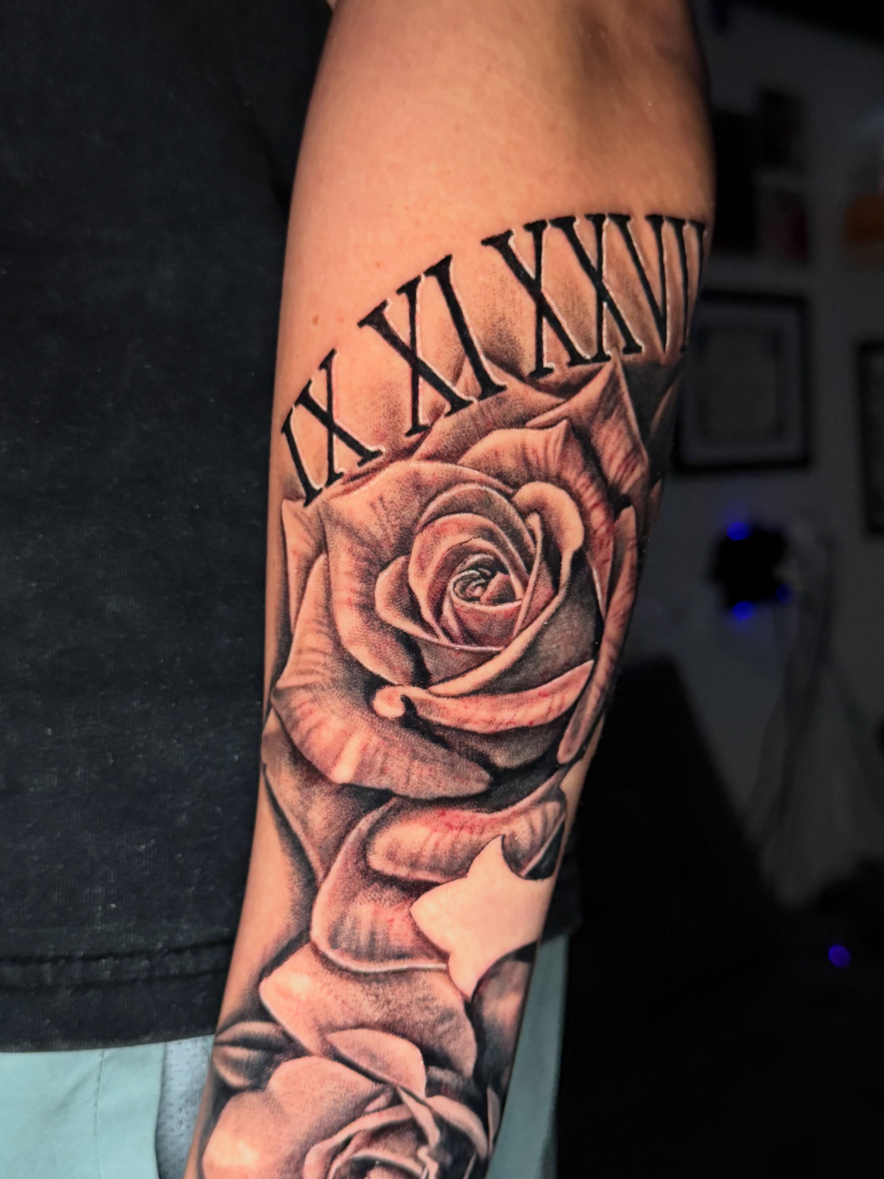 Rose and roman numerals realism tattoo on the forearm by Quentin Stevenson, Slidell, Louisiana