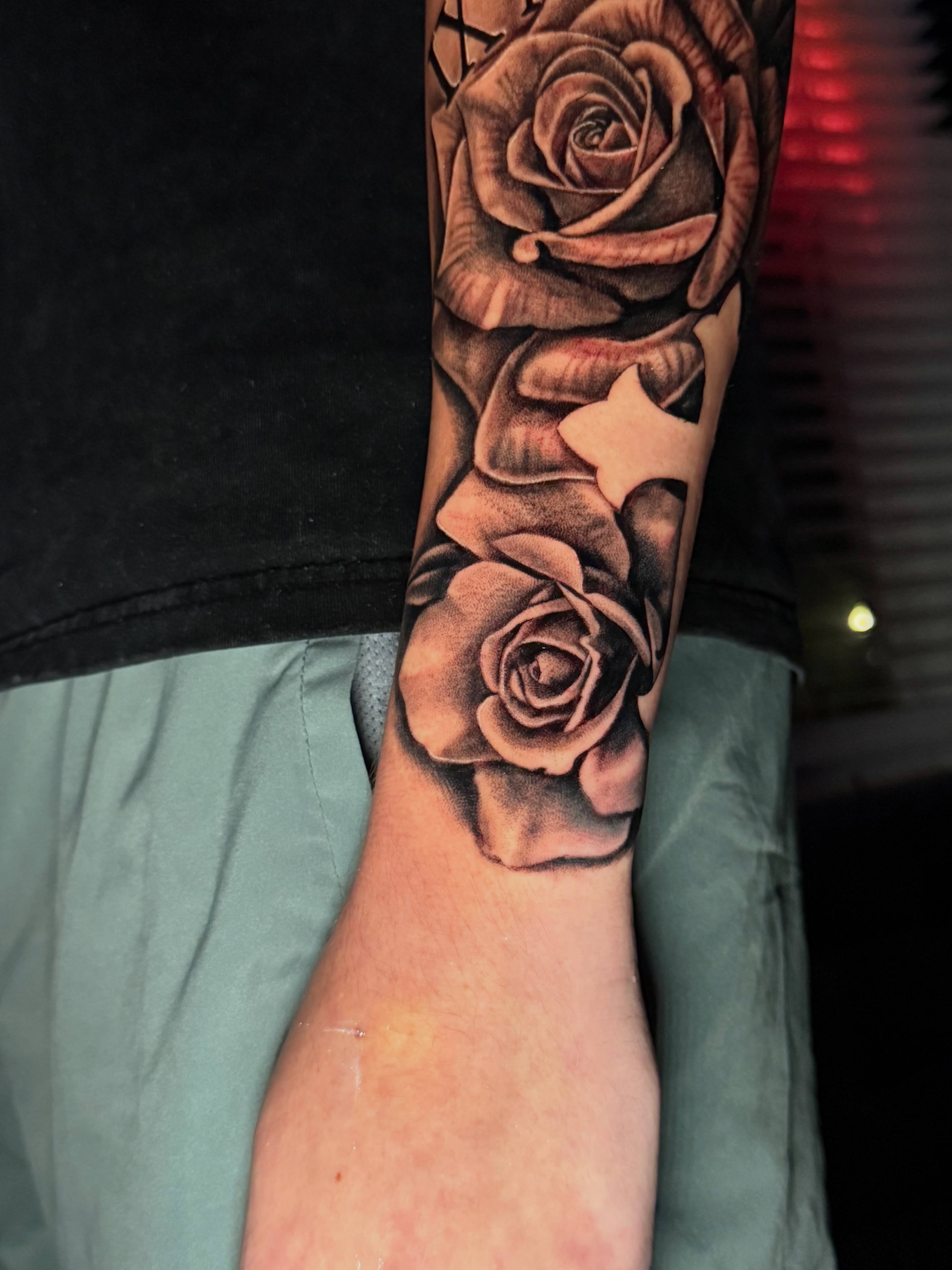 Roses black and grey tattoo on the forearm by Quentin Stevenson, Slidell, Louisiana