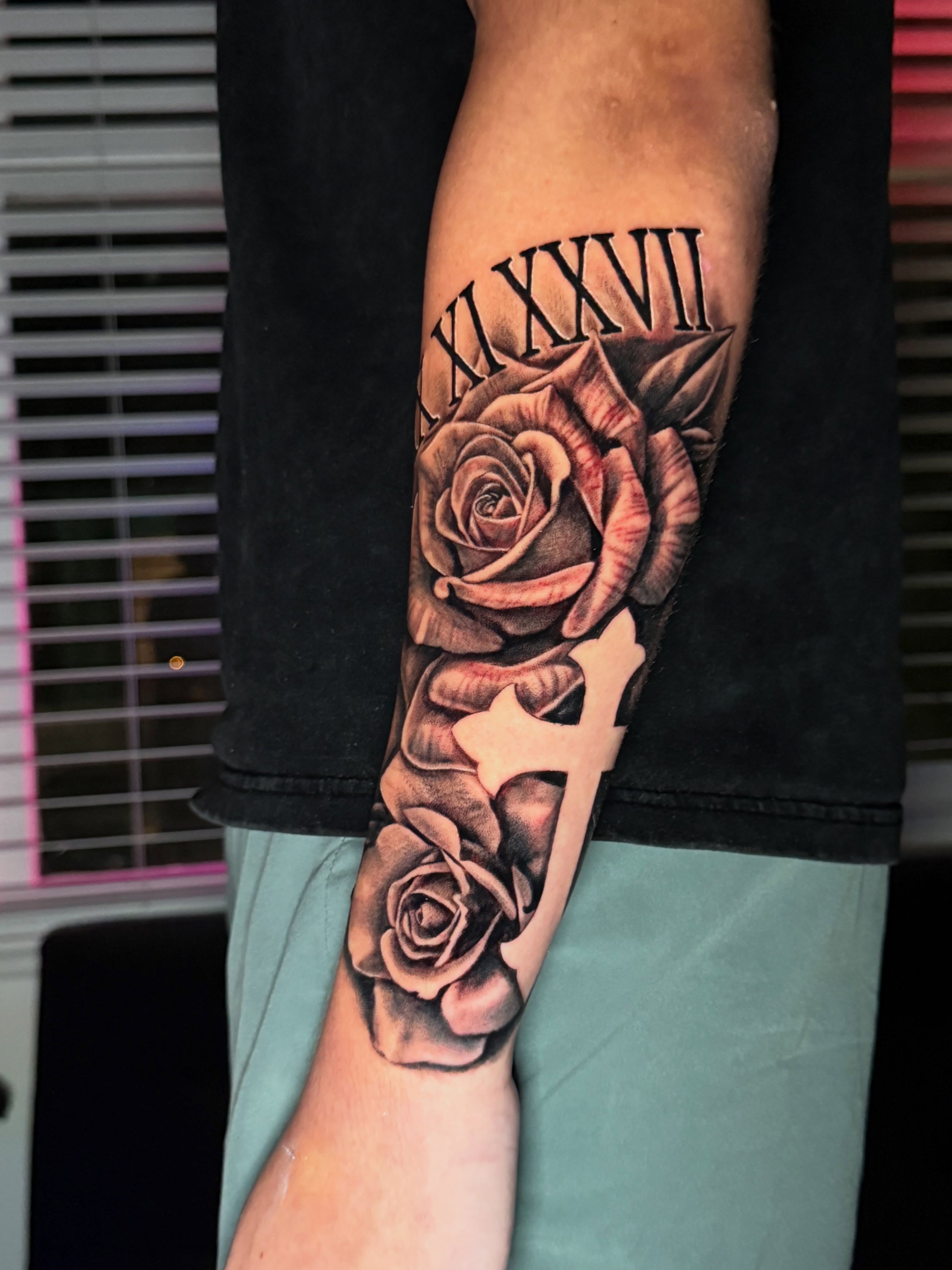 Roses and cross realism tattoo on the forearm by Quentin Stevenson, Slidell, Louisiana
