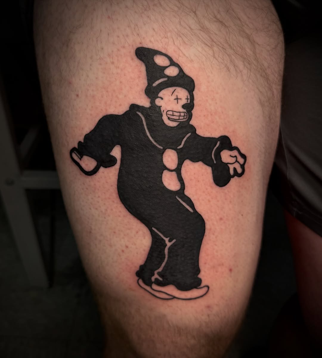 Clown character dark art tattoo on the thigh by sᴋᴇᴛᴄʜᴇᴅ