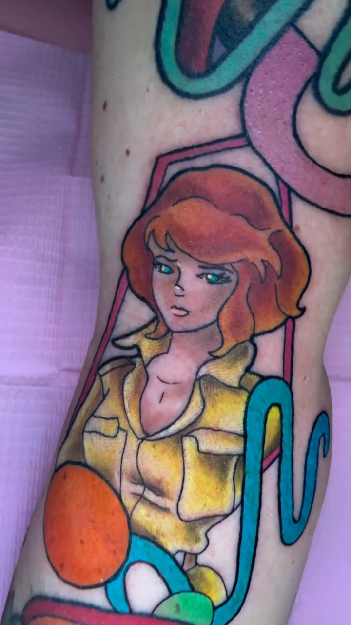 April O'Neil from TMNT neo-traditional tattoo on the forearm by Erin Peterson