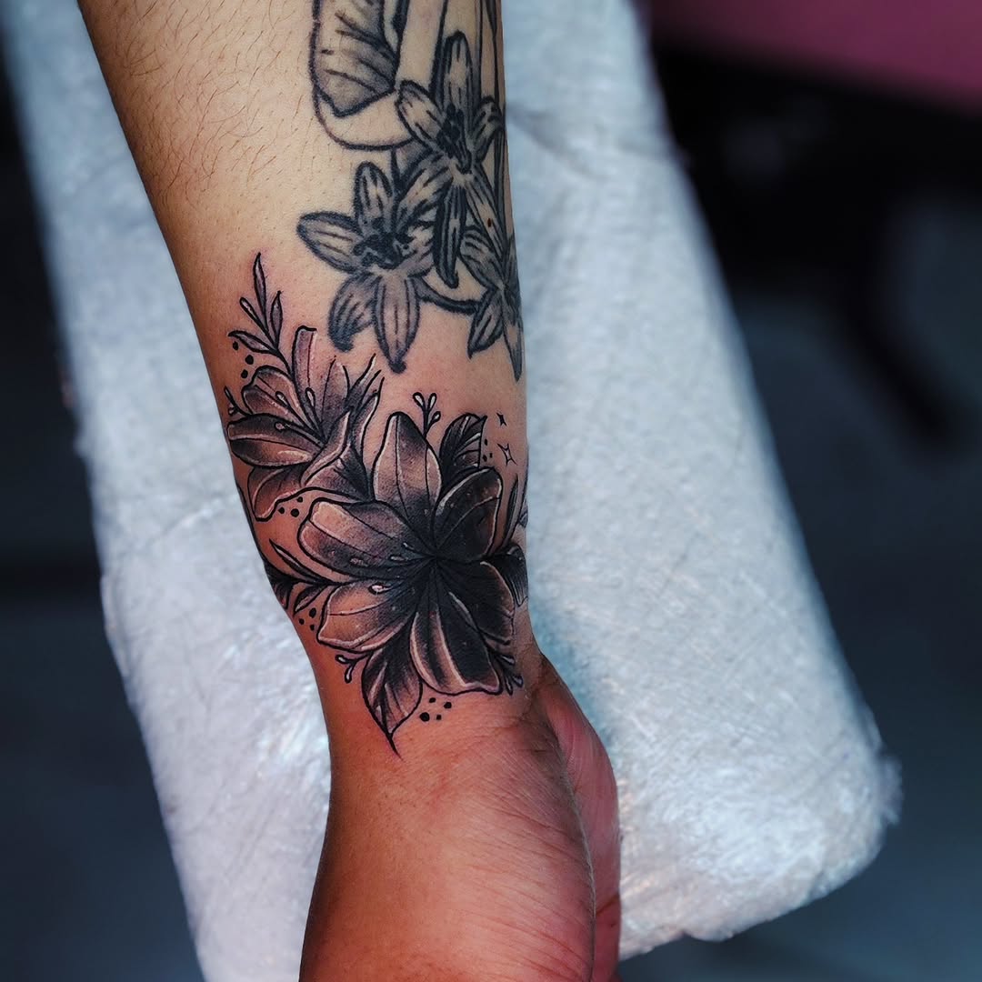 Lily flowers fine line tattoo on the forearm by Kai_Tattoo