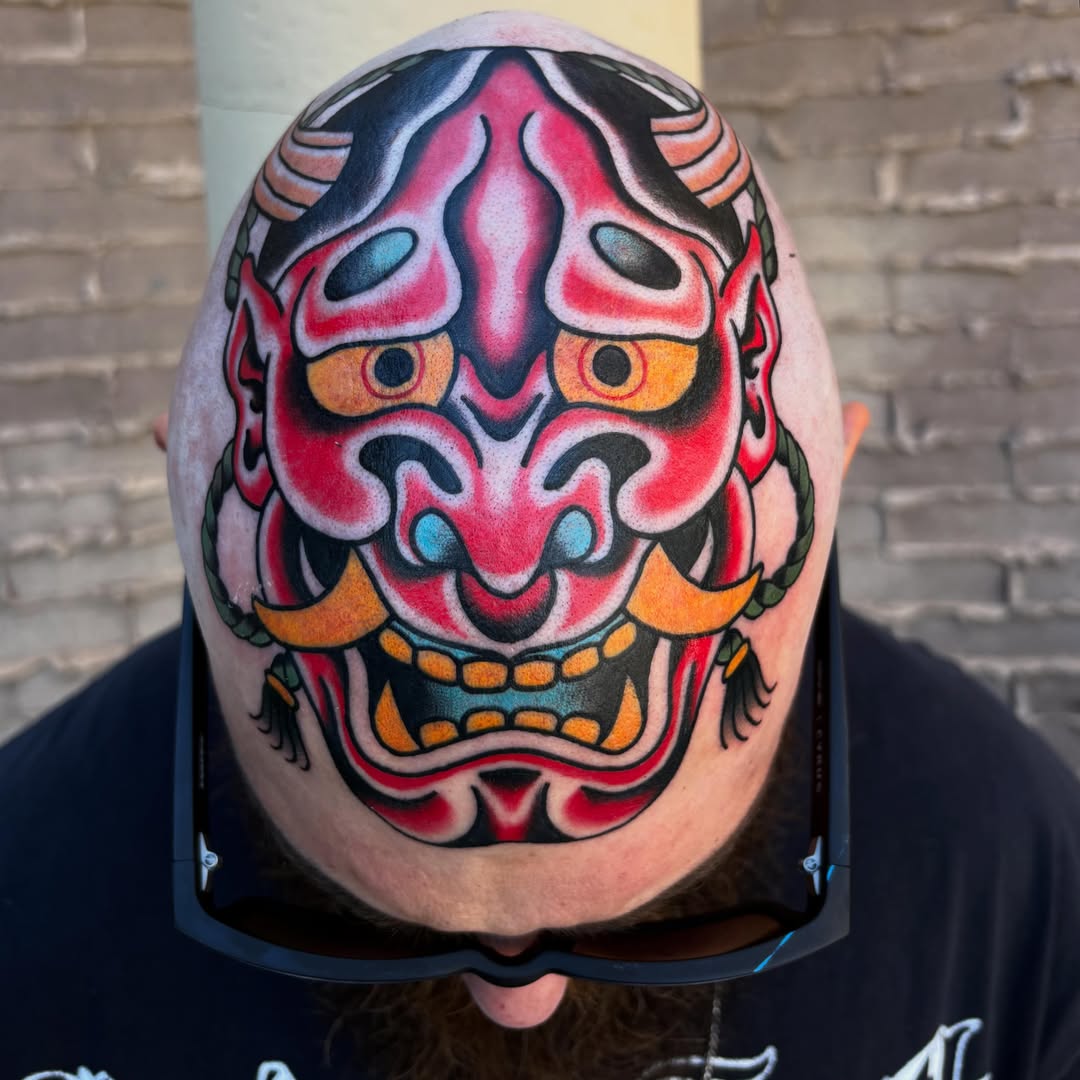 Demon mask American traditional tattoo on the head by Allyson Monique