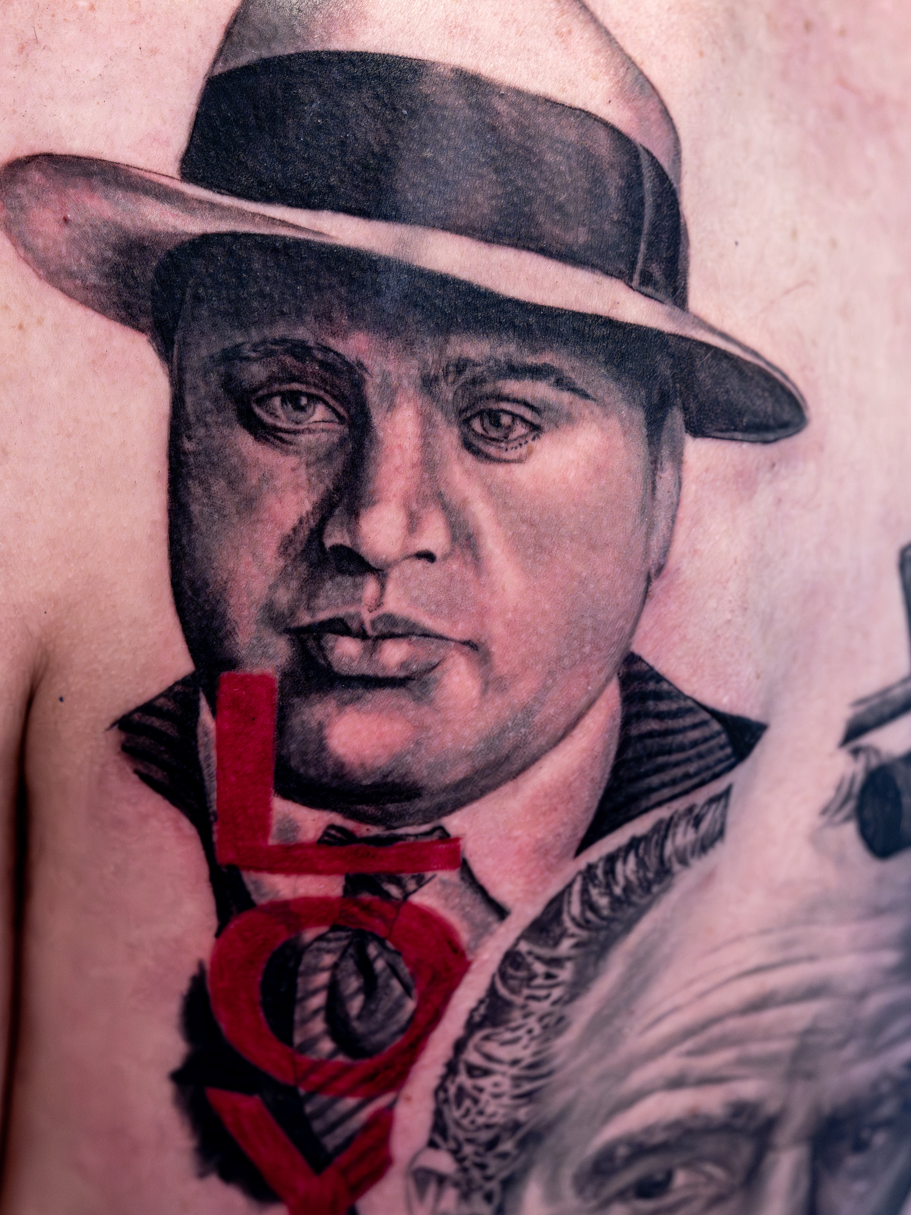 Gangster portrait realism tattoo on the chest by Simon Pouliot