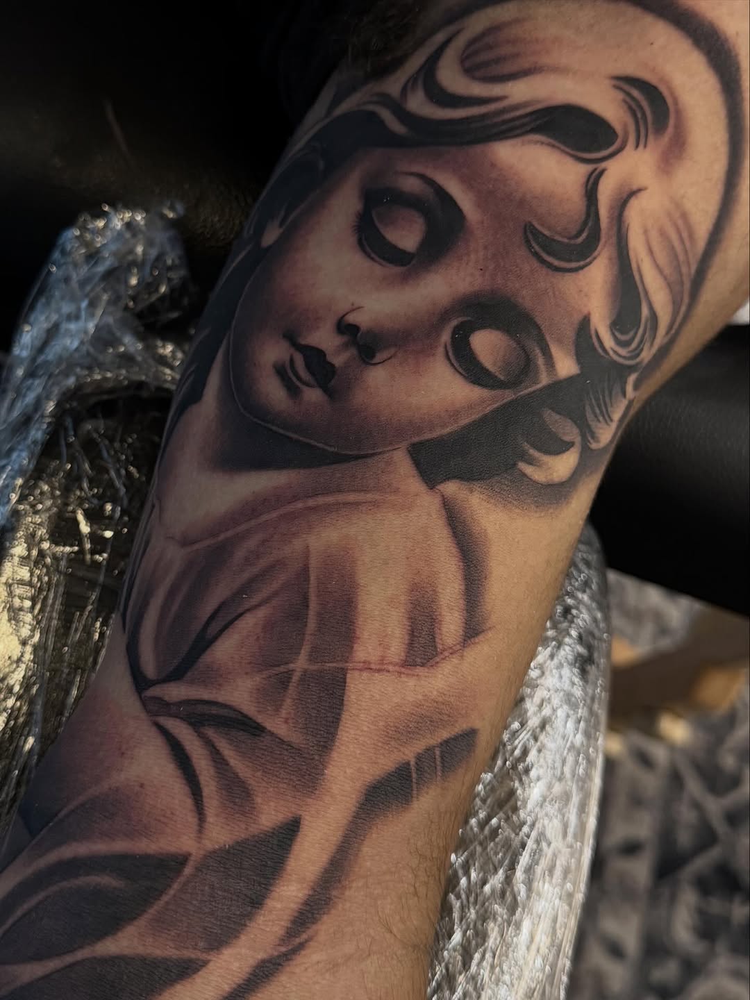 Tattoo by @angel_damiangg — realism, black_and_grey
