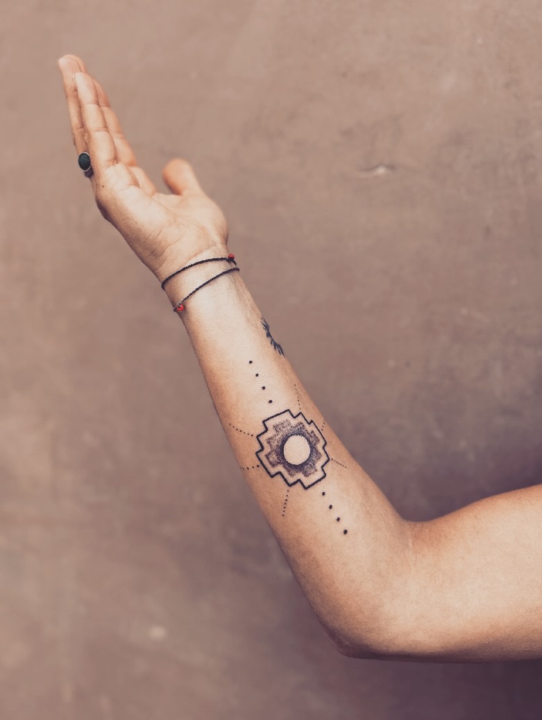 Geometric symbol with dots geometric tattoo on the forearm by Gaya