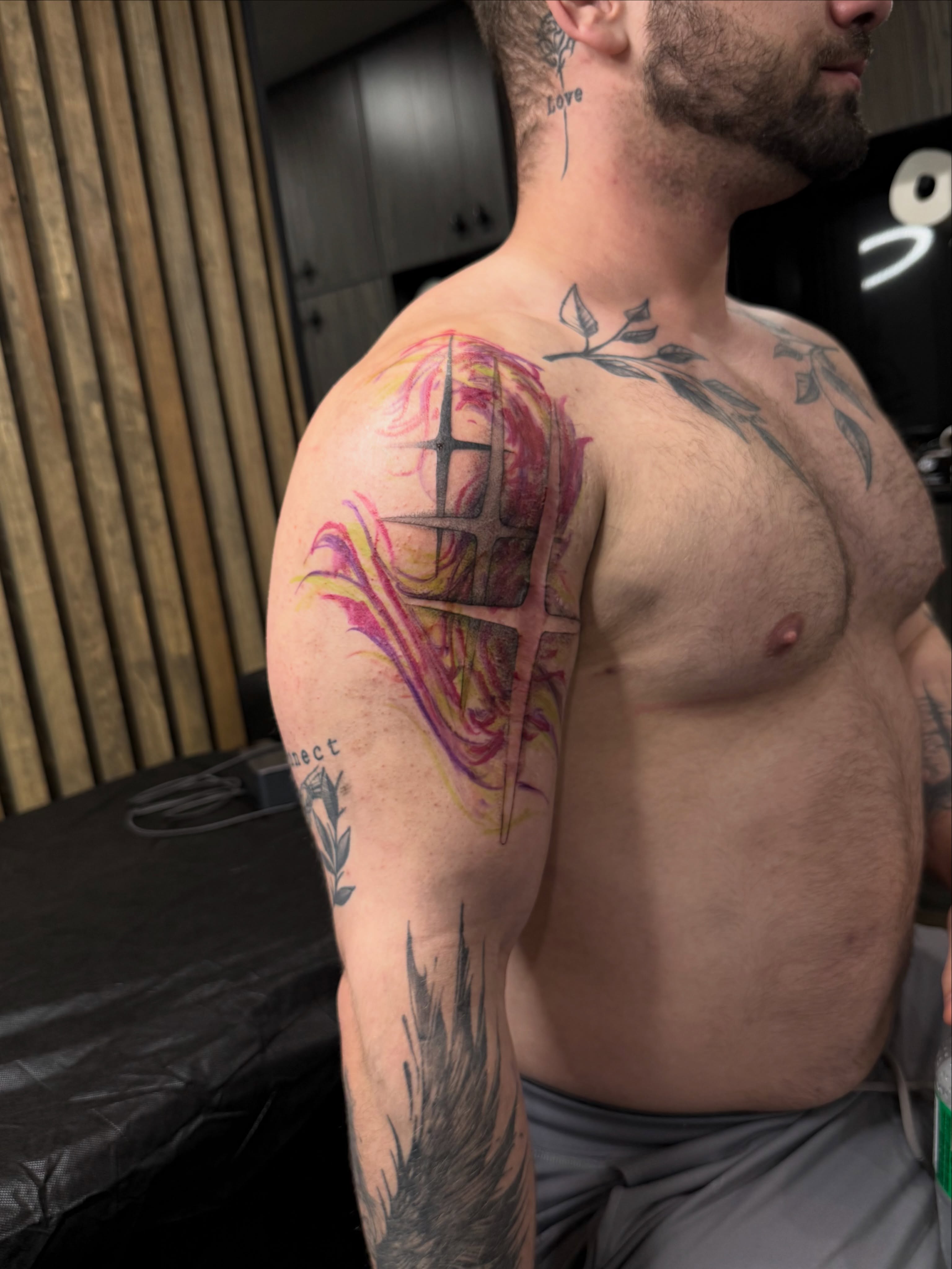 Cross with flame neo-traditional tattoo on the shoulder by Vold