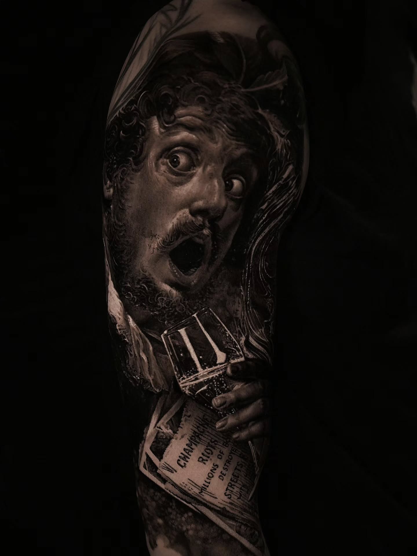 Portrait with open mouth realism tattoo on the forearm by Owen Paulls