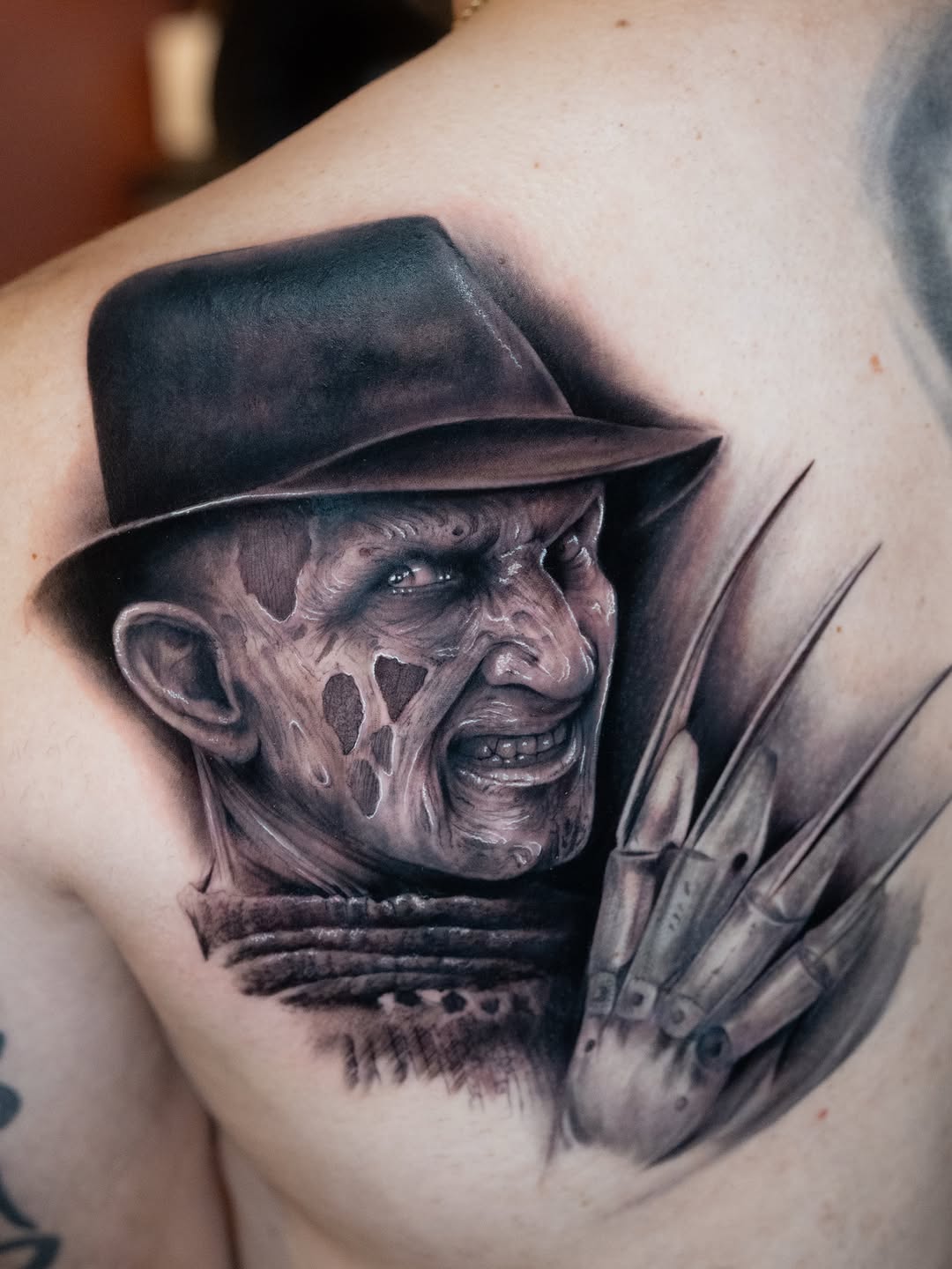 Freddy Krueger portrait realism tattoo on the shoulder by Franz Muñoz