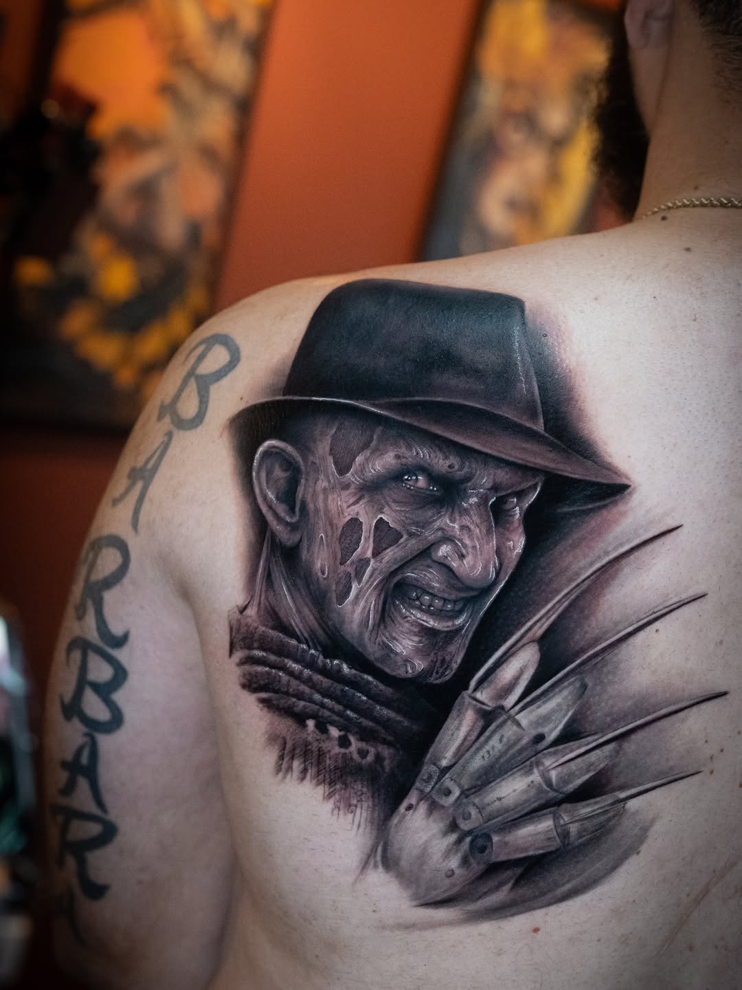 Freddy Krueger portrait realism tattoo on the shoulder by Franz Muñoz