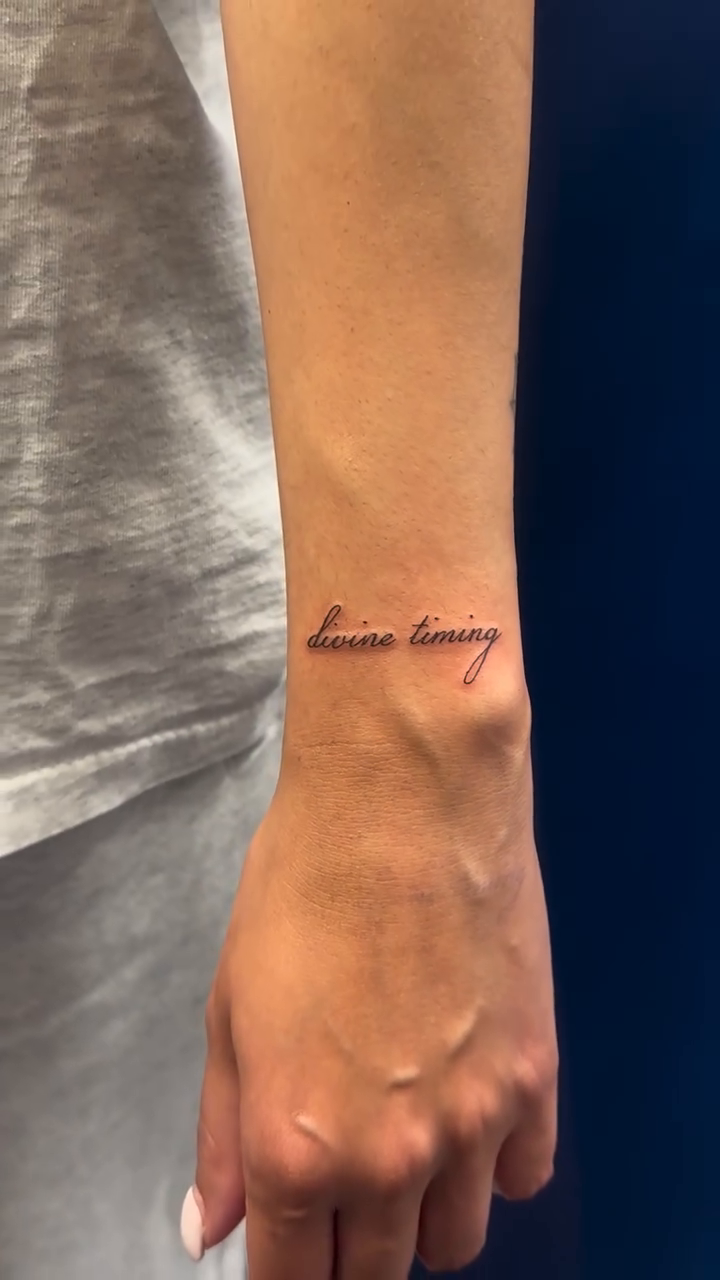 Cursive script tattoo on wrist lettering tattoo on the forearm by Tattoo Takayo