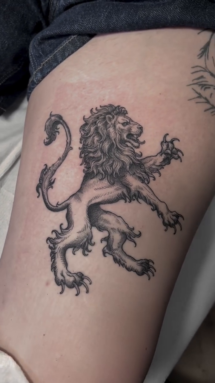 Lion rampant realism tattoo on the leg by Woodrow Robinson