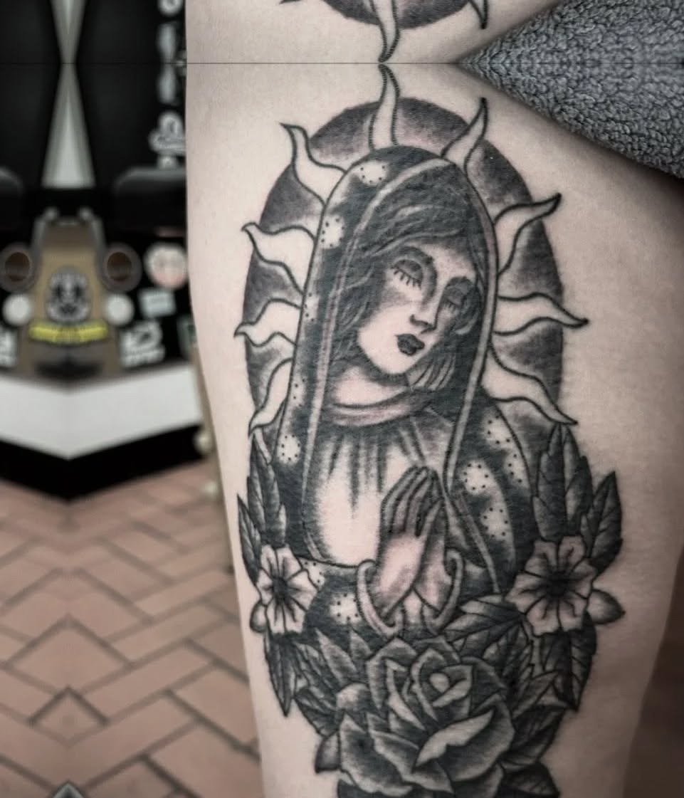 Virgin Mary with roses realism tattoo on the thigh by Jaleel Trantow