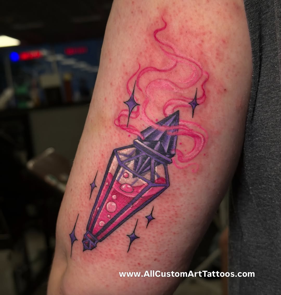 Potion bottle with smoke and stars tattoo on the forearm by Rafael Marte, White Plains, New York