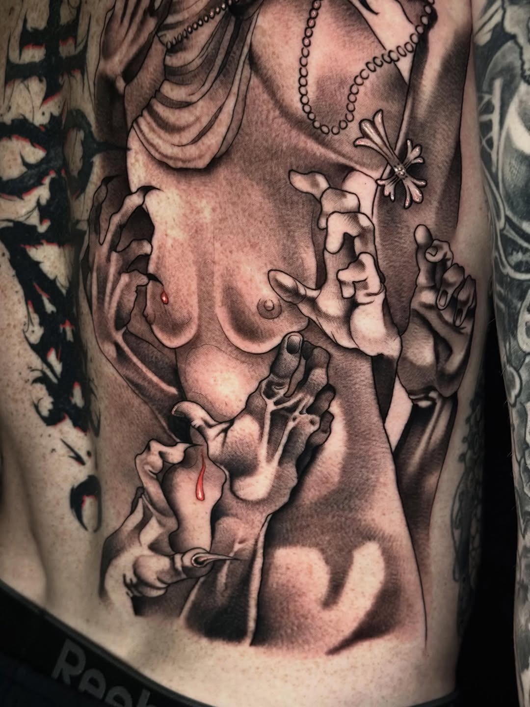 Tattoo by @mad_s_ink — dark_realism, black_and_grey