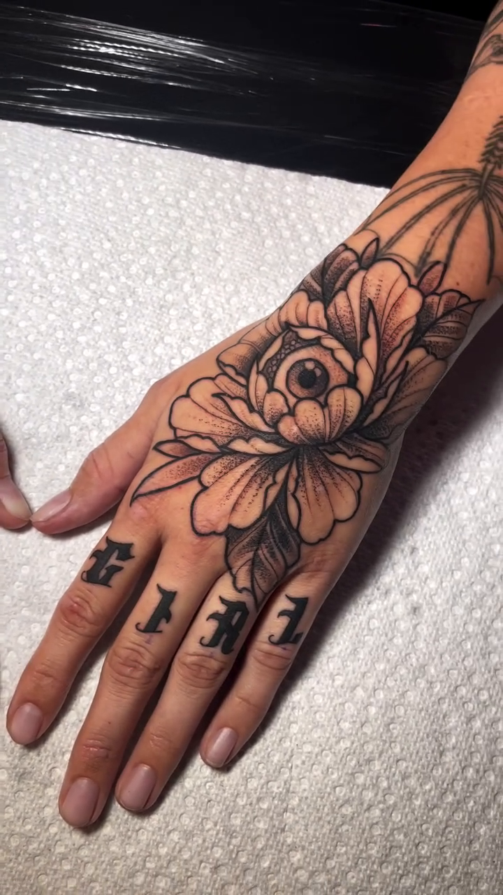 Peony and lettering on hand fine line tattoo by Dev Z
