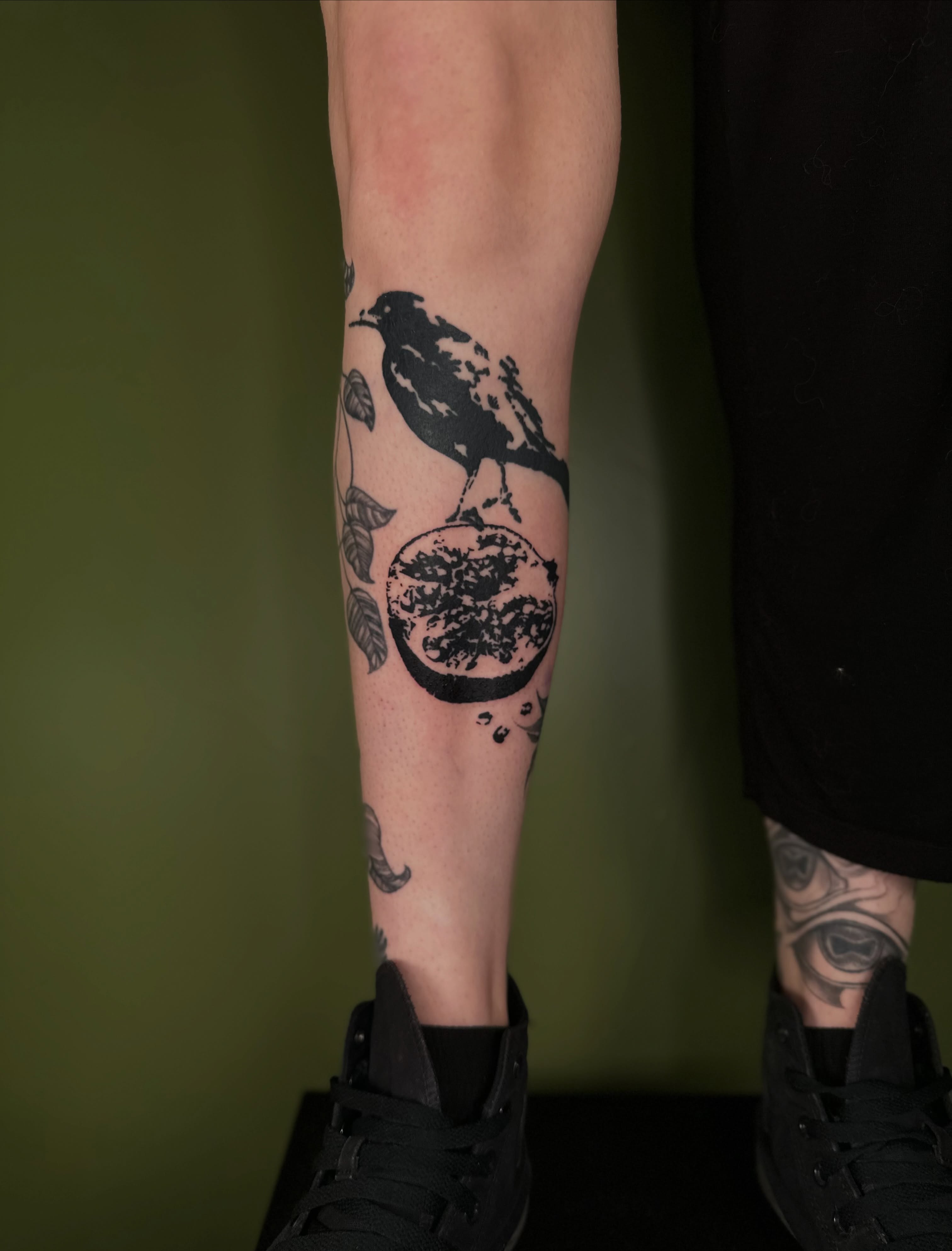 Crow and moon black and grey tattoo on the forearm by Nikolas Tapio Aatos Mäkelä