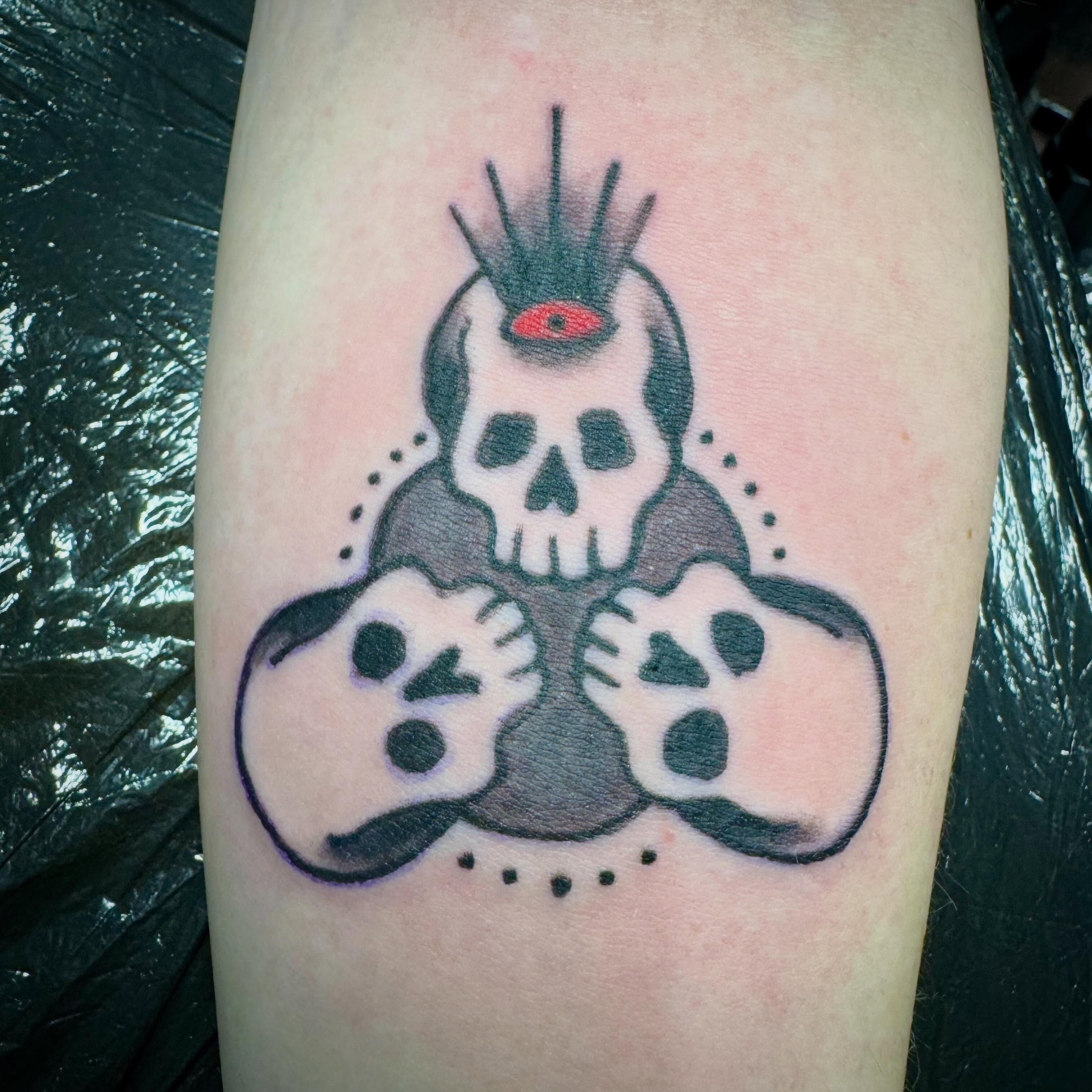 Skull with wings American traditional tattoo on the forearm by Bob Lindell Tattoos