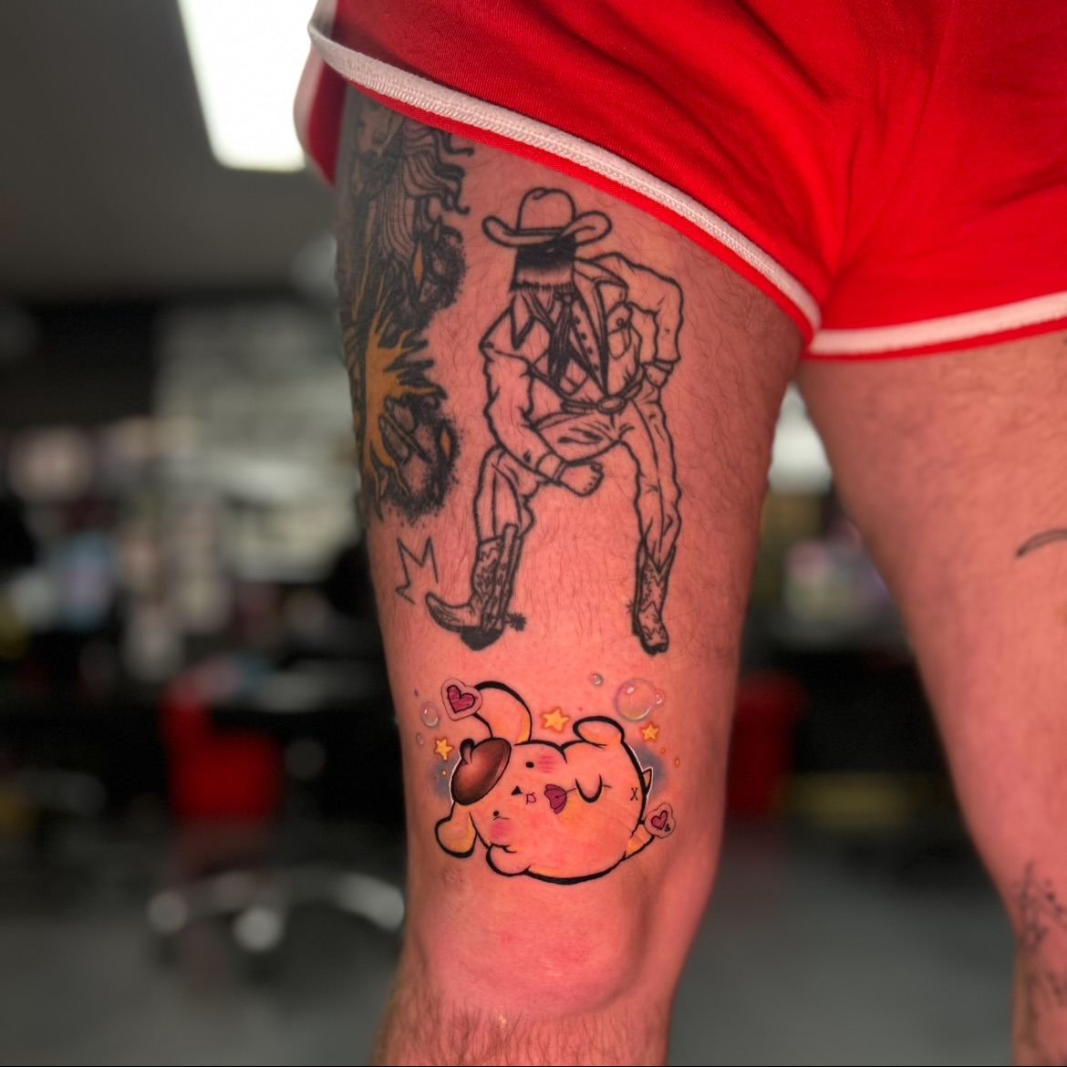 Cowboy and puppy American traditional tattoo on the thigh by Maara Martinez