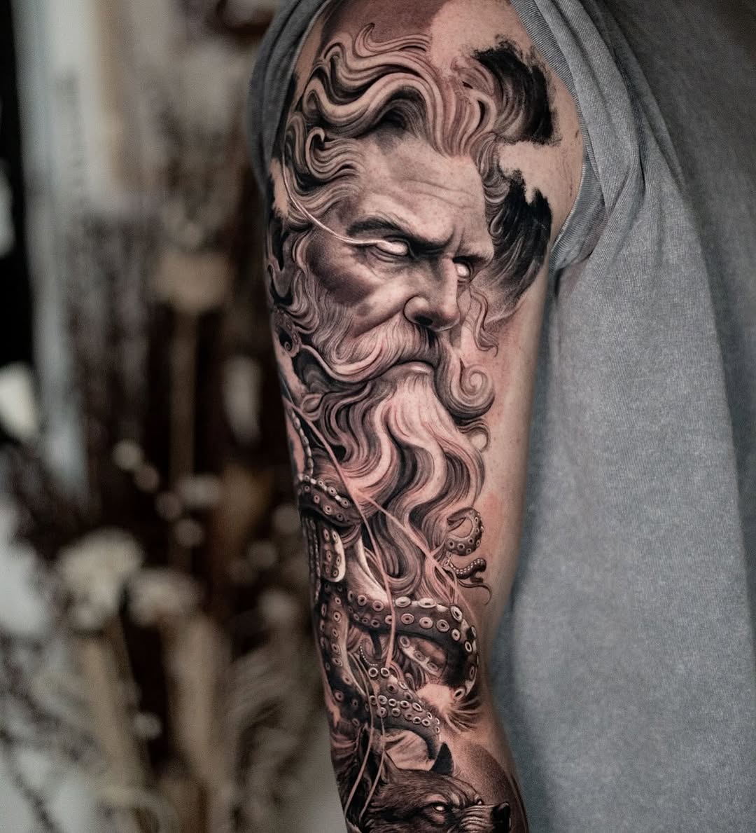 Man with beard and octopus realism tattoo on the forearm by Andres Acevedo, Denver, Colorado