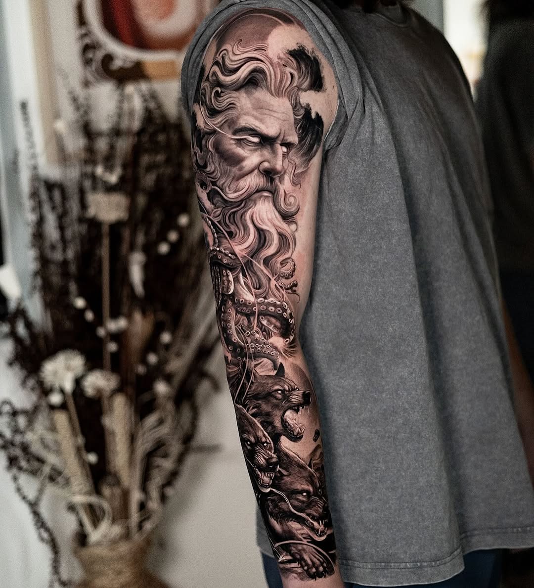 Man with beard, octopus, and wolves Japanese tattoo on the forearm by Andres Acevedo, Denver, Colorado