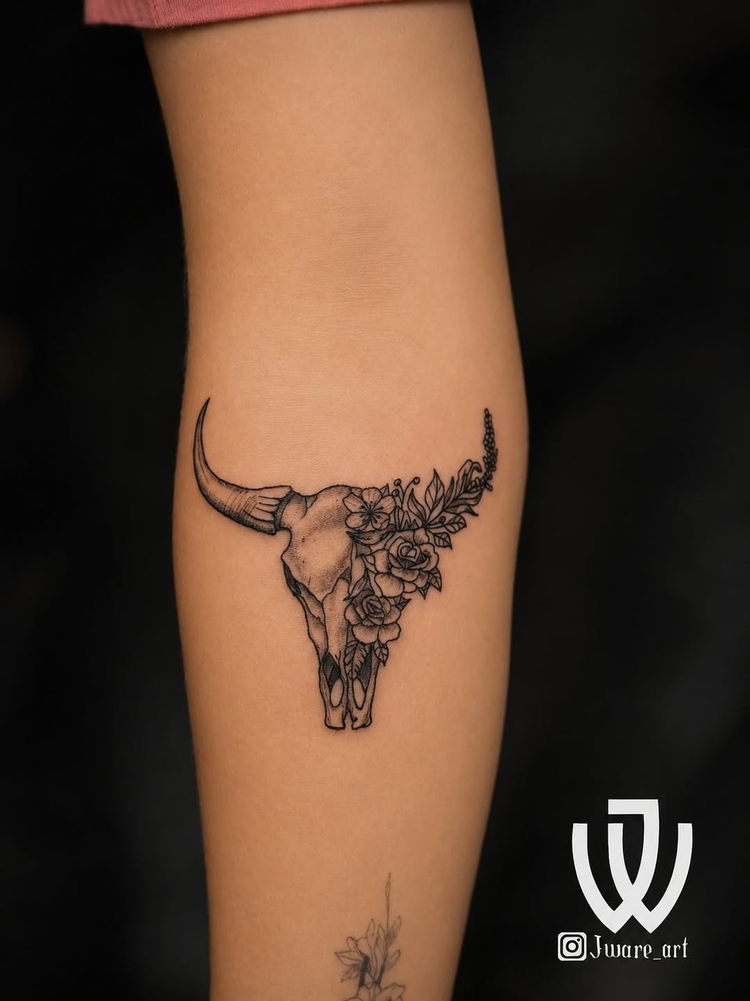 Bull skull with flowers dark art tattoo on the forearm by Joshua Ware, Alvarado, Texas