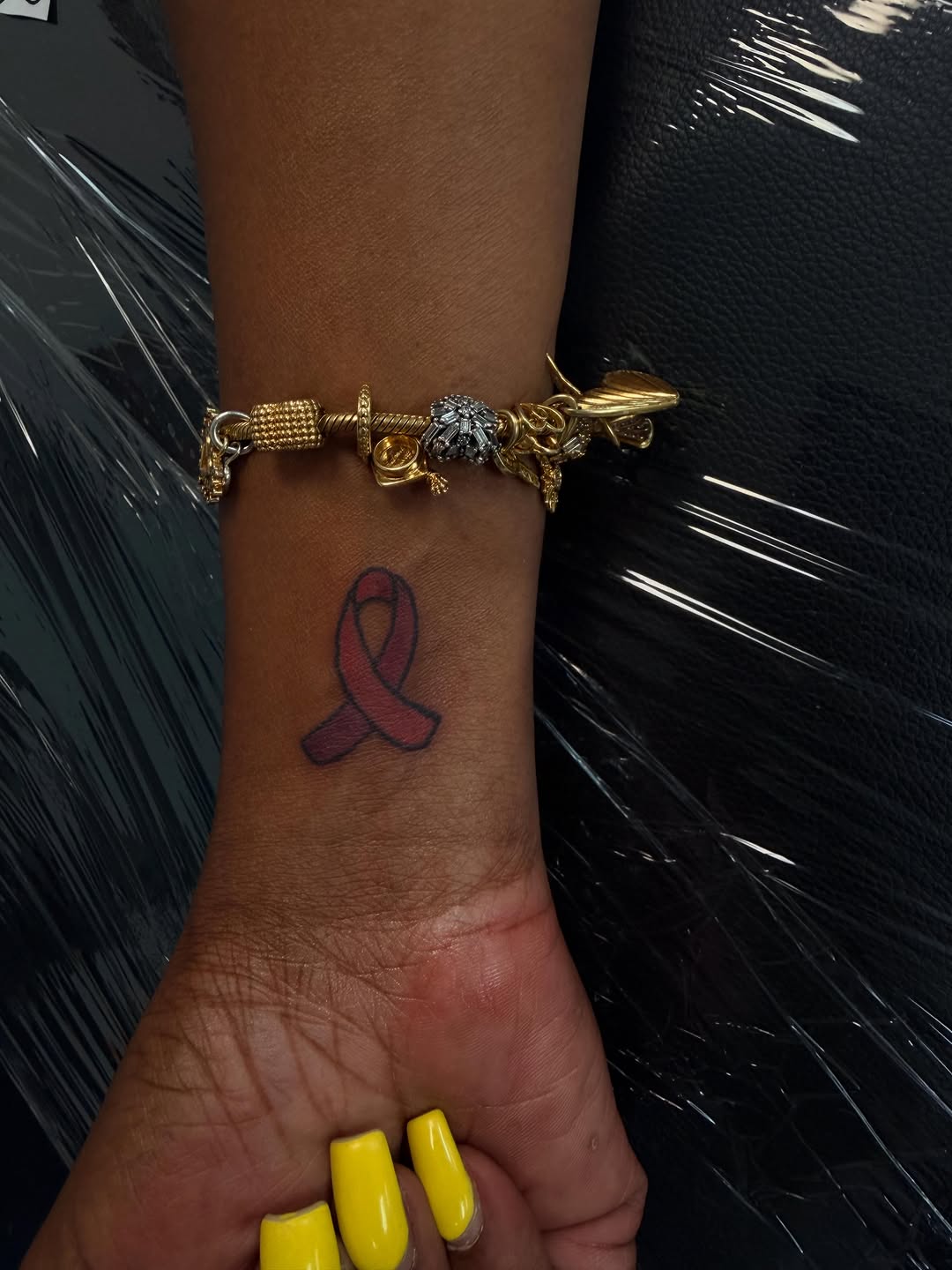 Awareness ribbon tattoo on the forearm by Rylan Thorndyke - Tattoo Artist, Las Vegas, Nevada
