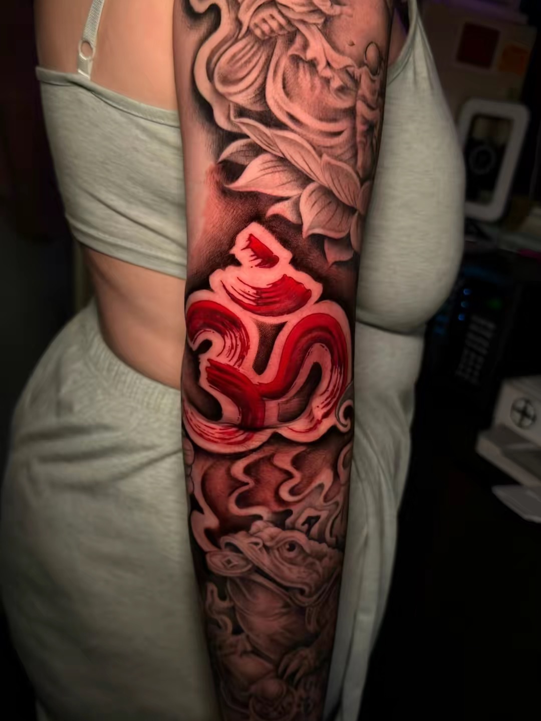 Om symbol black and grey tattoo on the forearm by Arizona Tattoo Artist, Phoenix, Arizona