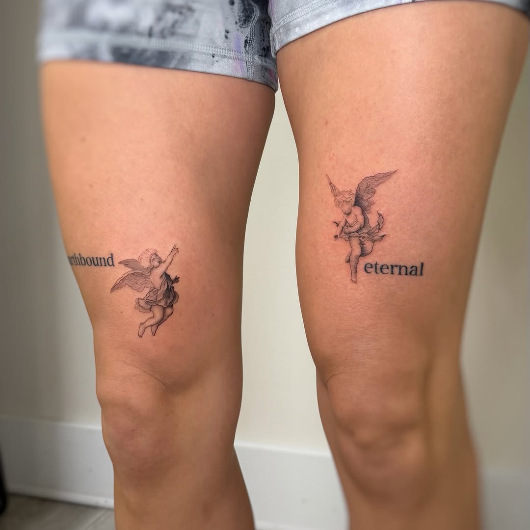 Cherub with lettering lettering tattoo on the leg by David