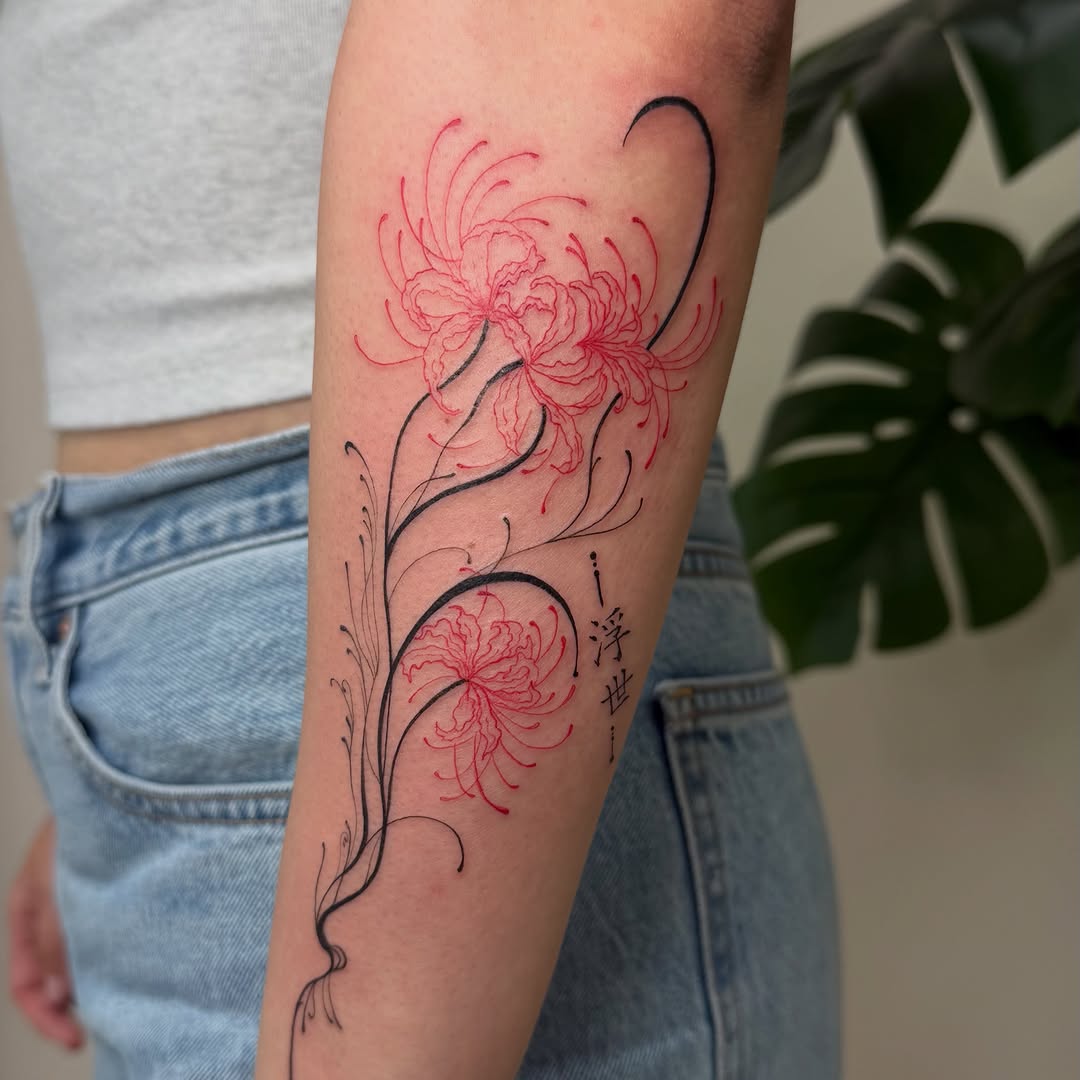 Red spider lilies with script fine line tattoo on the forearm by David