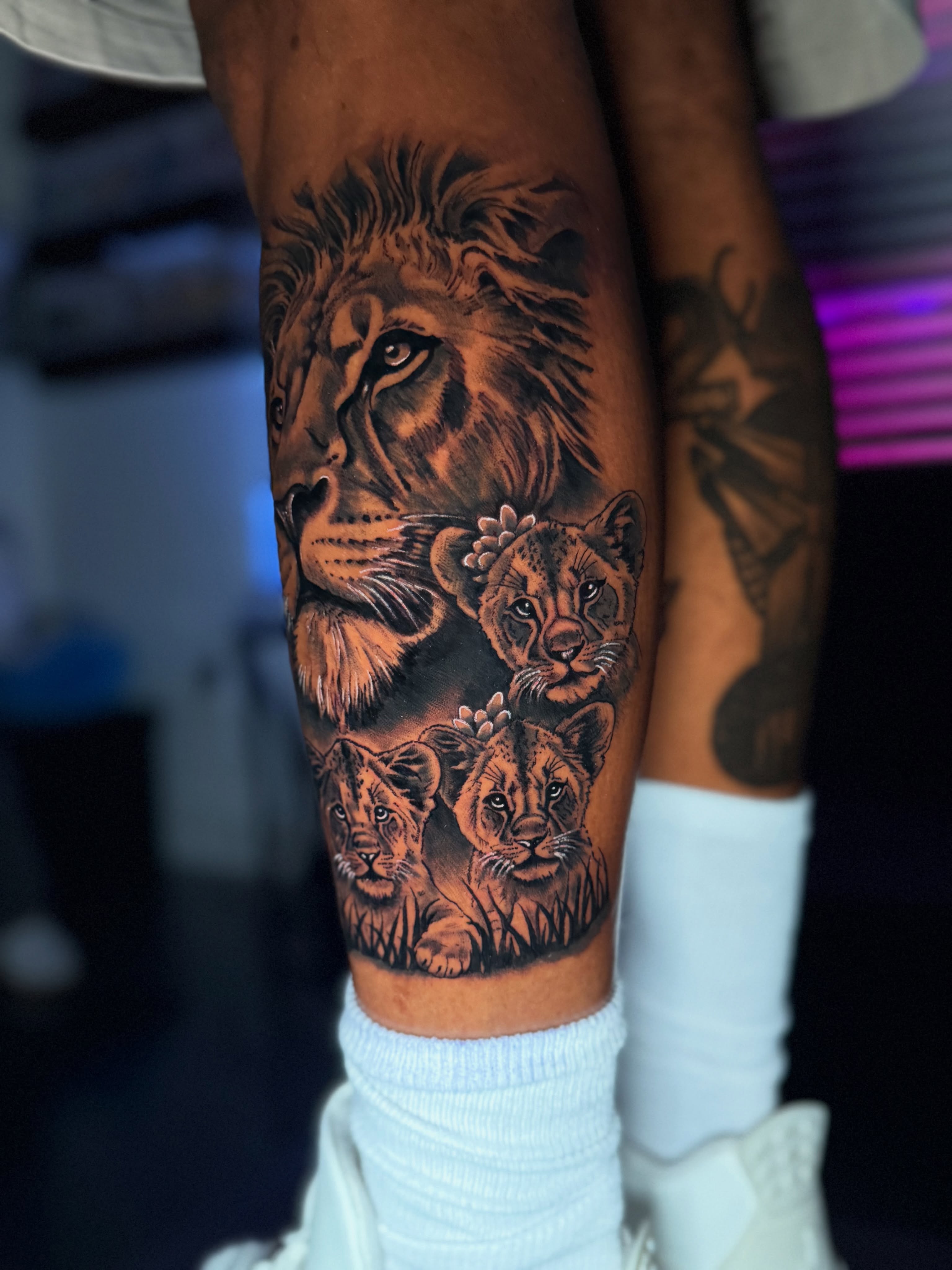 Lion family realism tattoo on the forearm by Quentin Stevenson, Slidell, Louisiana