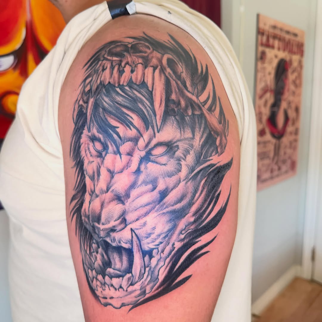 Demon lion head realism tattoo on the shoulder by Bryan Hunt