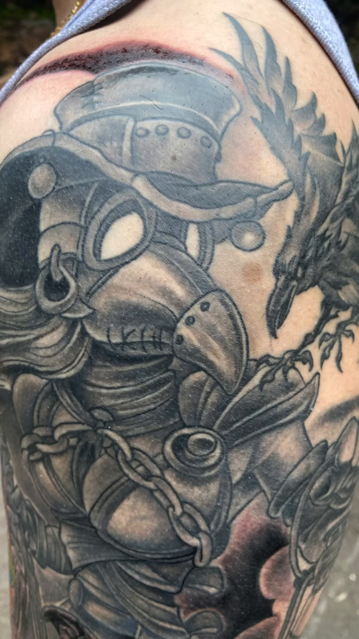 Plague doctor with dragon and lion dark realism tattoo by Joe Capobianco, New Haven, Connecticut