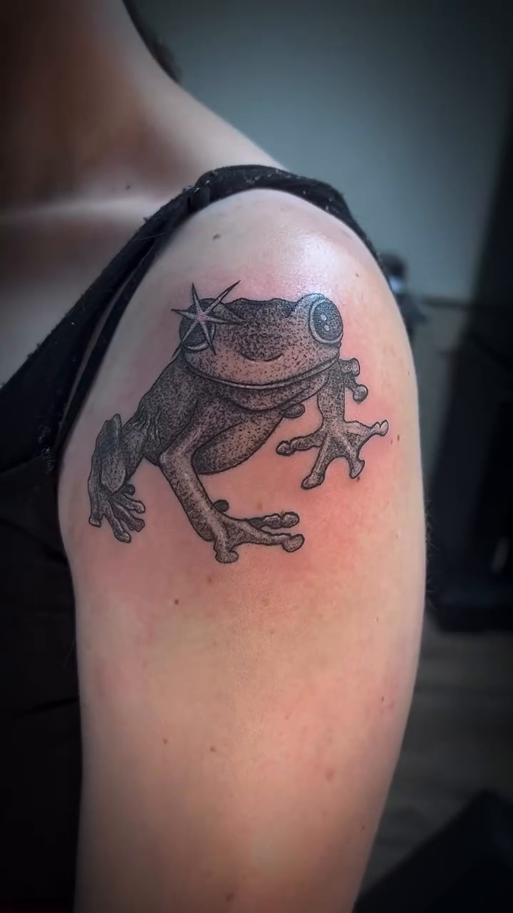 Frog tattoo American traditional tattoo on the shoulder by Nikki Ward