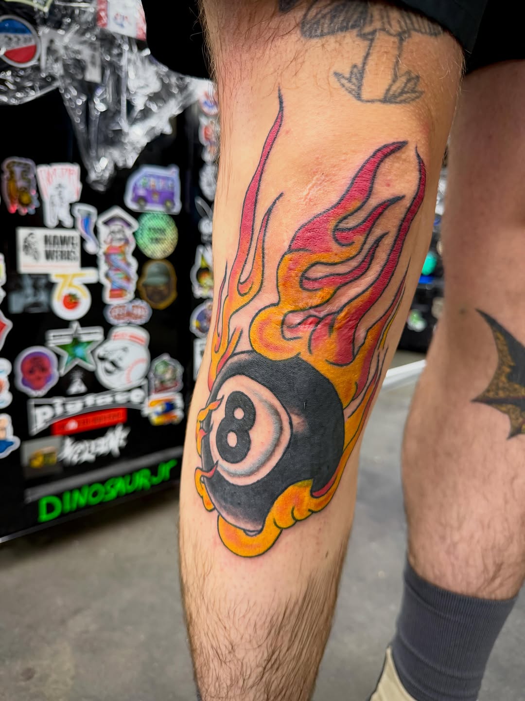 8 ball with flames American traditional tattoo on the forearm by Ali Calis