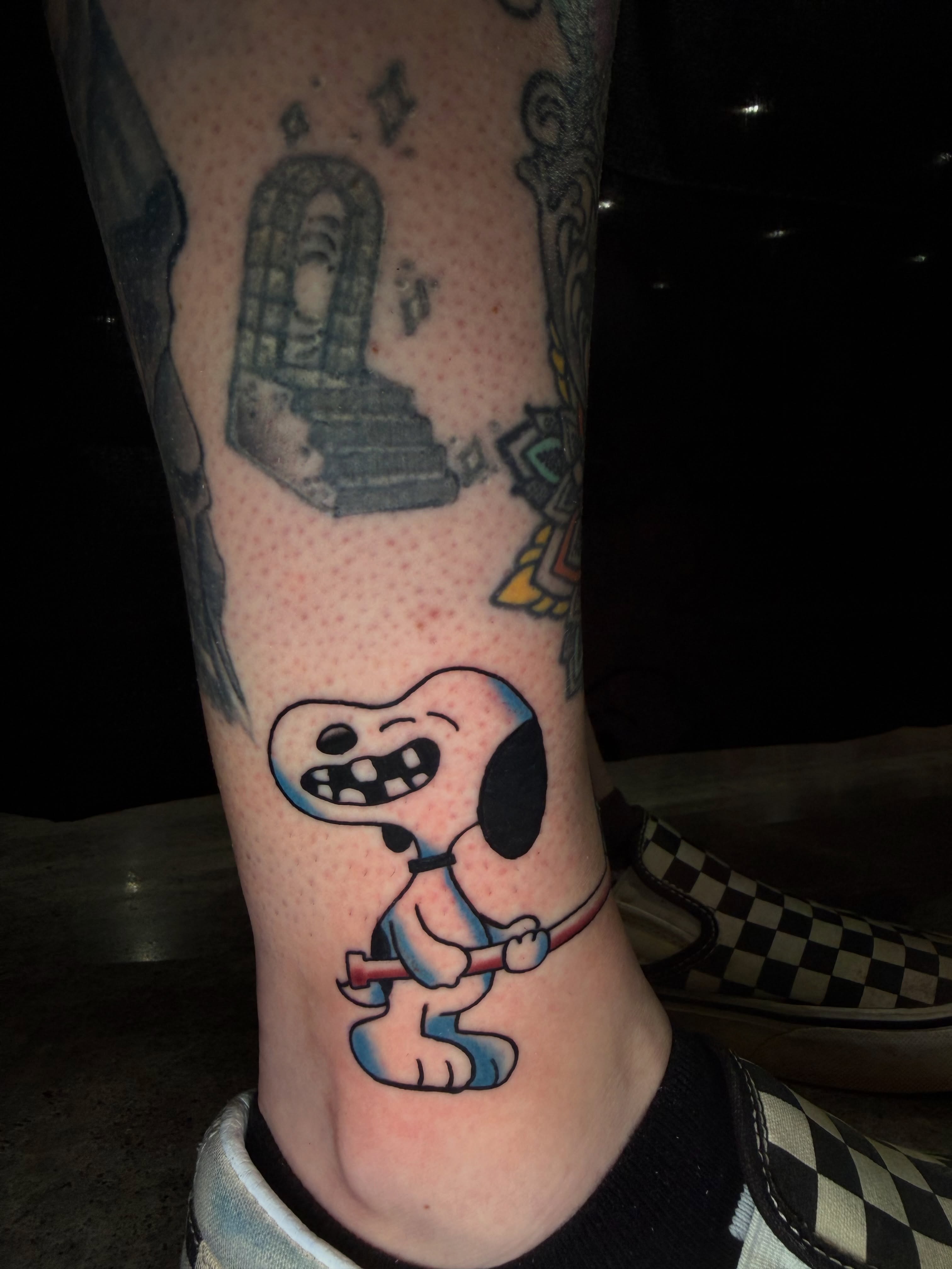 Snoopy American traditional tattoo on the foot by Dustie Pitstick