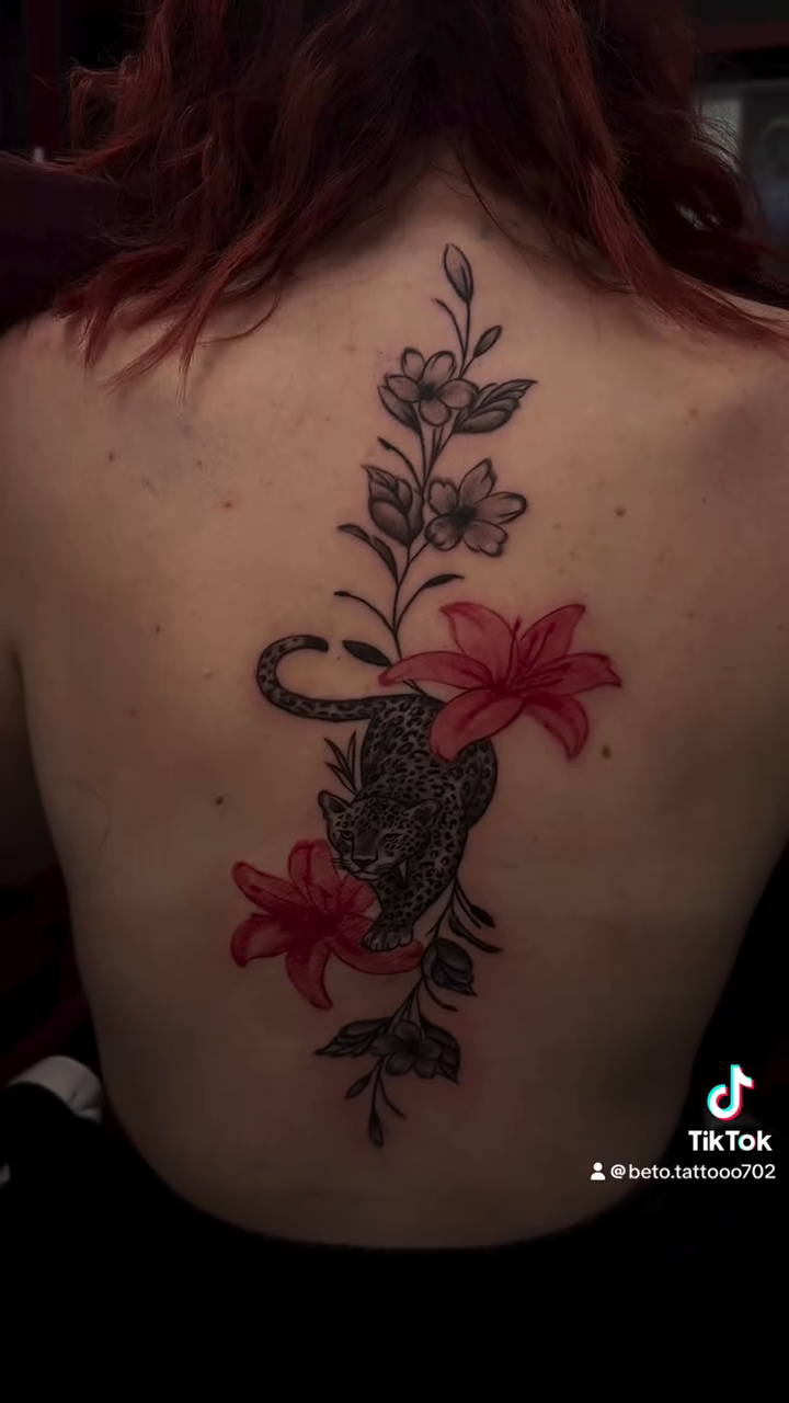 Panther and lilies on spine fine line tattoo on the back by Betotats