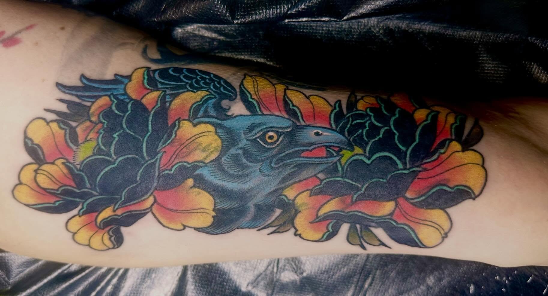 Crow and floral American traditional tattoo on the forearm by Jordan Rubin, Dunedin, Florida