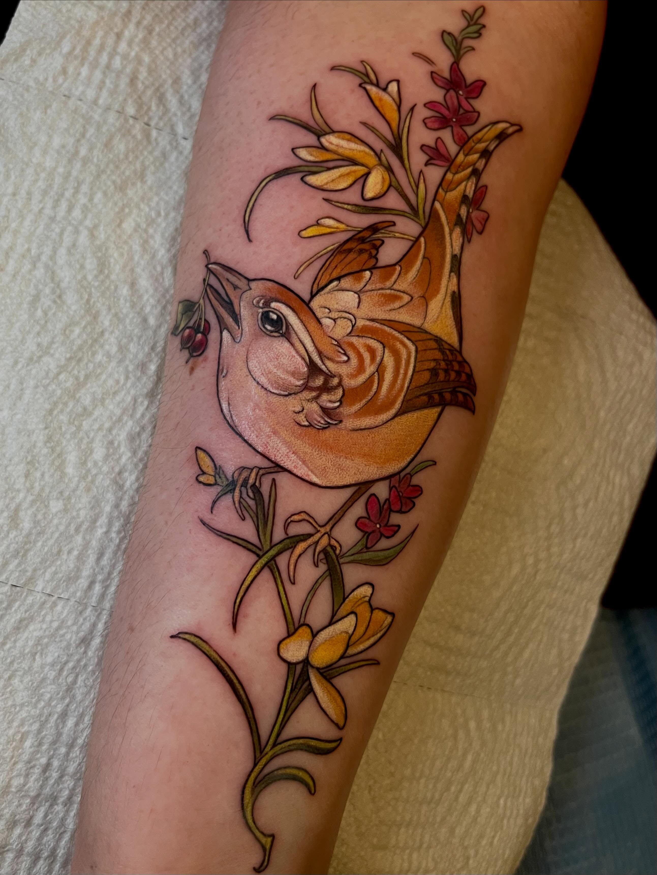 Bird and flowers new school tattoo on the forearm by Cassandra